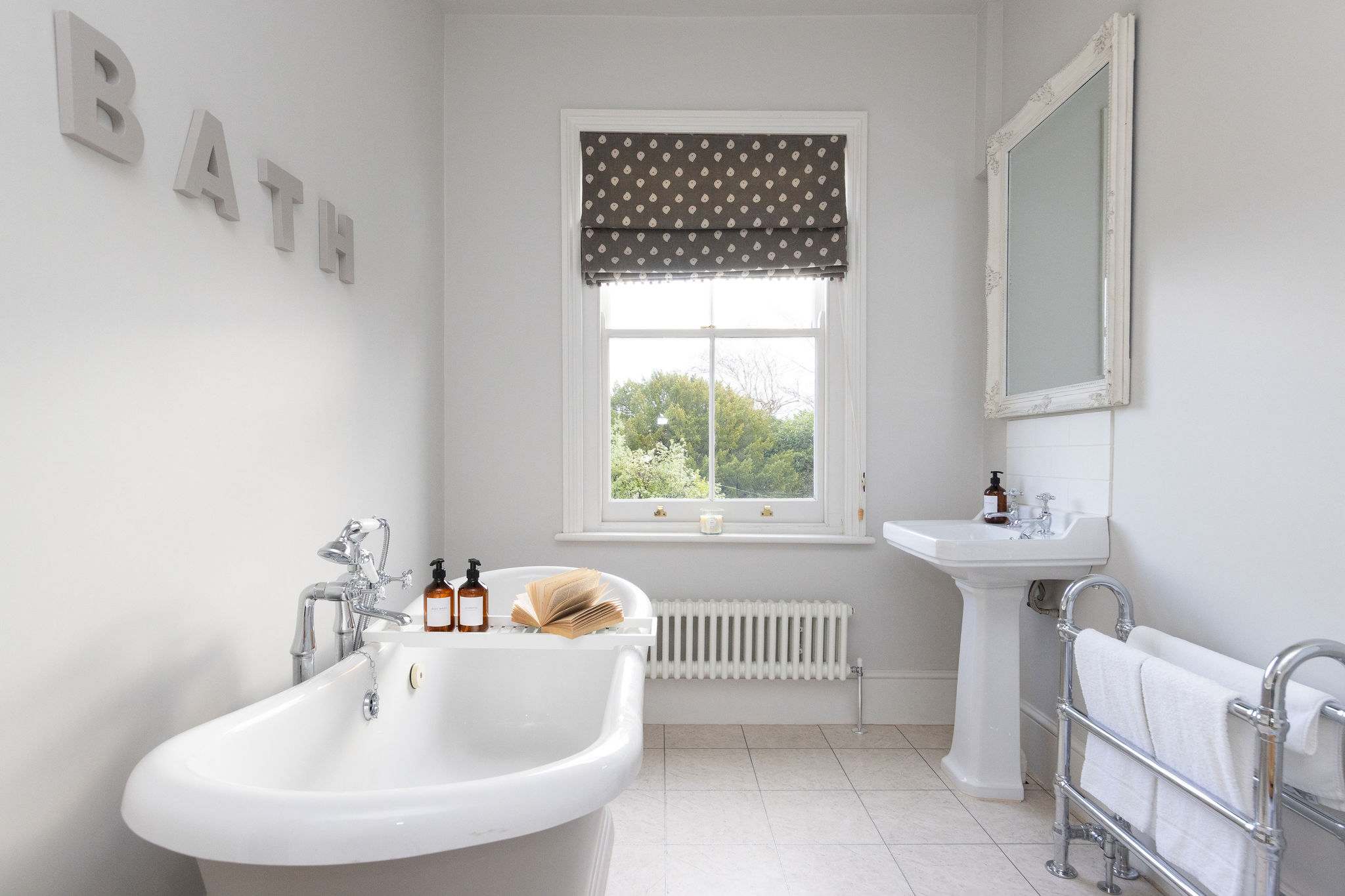 Bright bathroom with freestanding bath