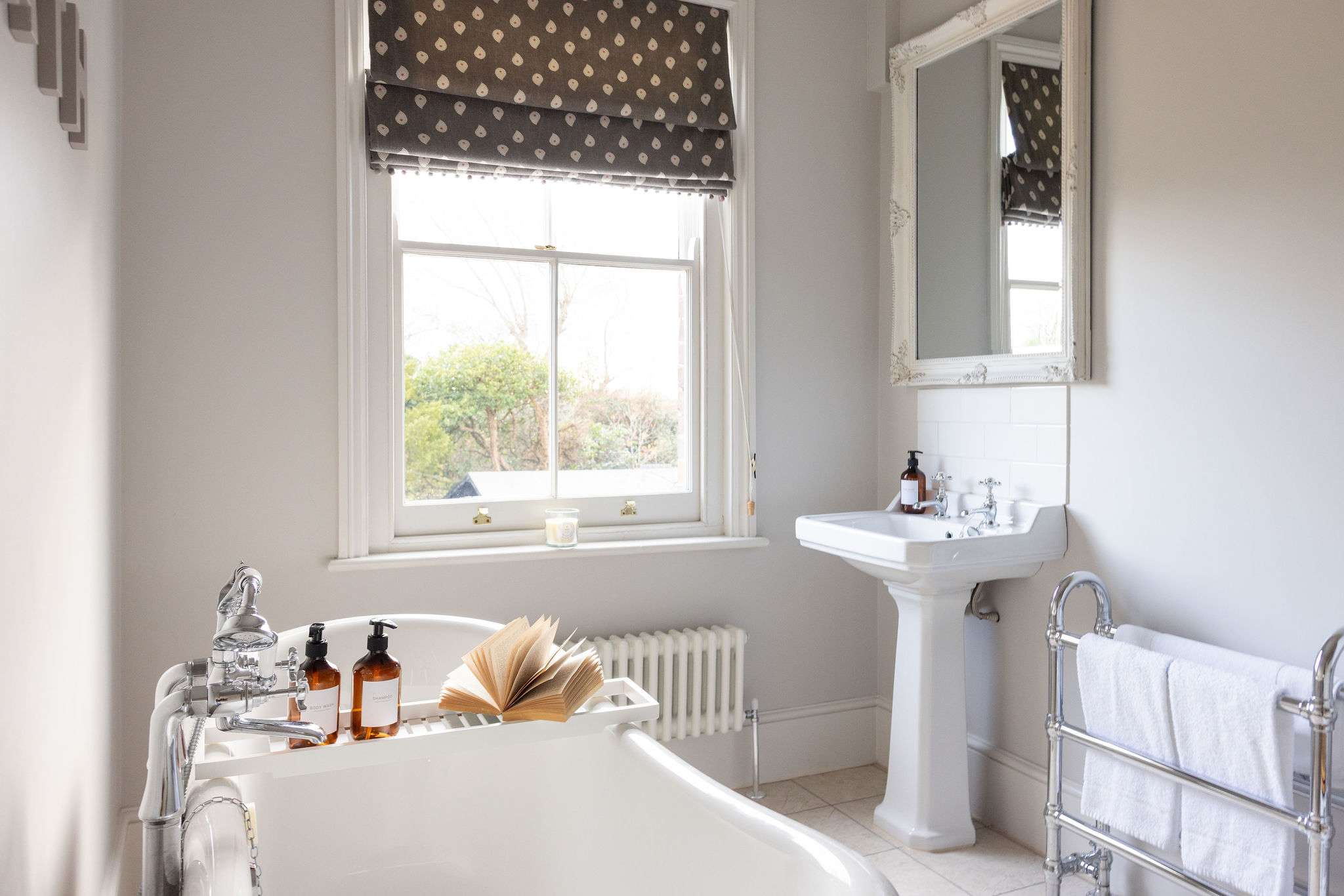 A gorgeous roll top bath sits in the main family bathroom.
