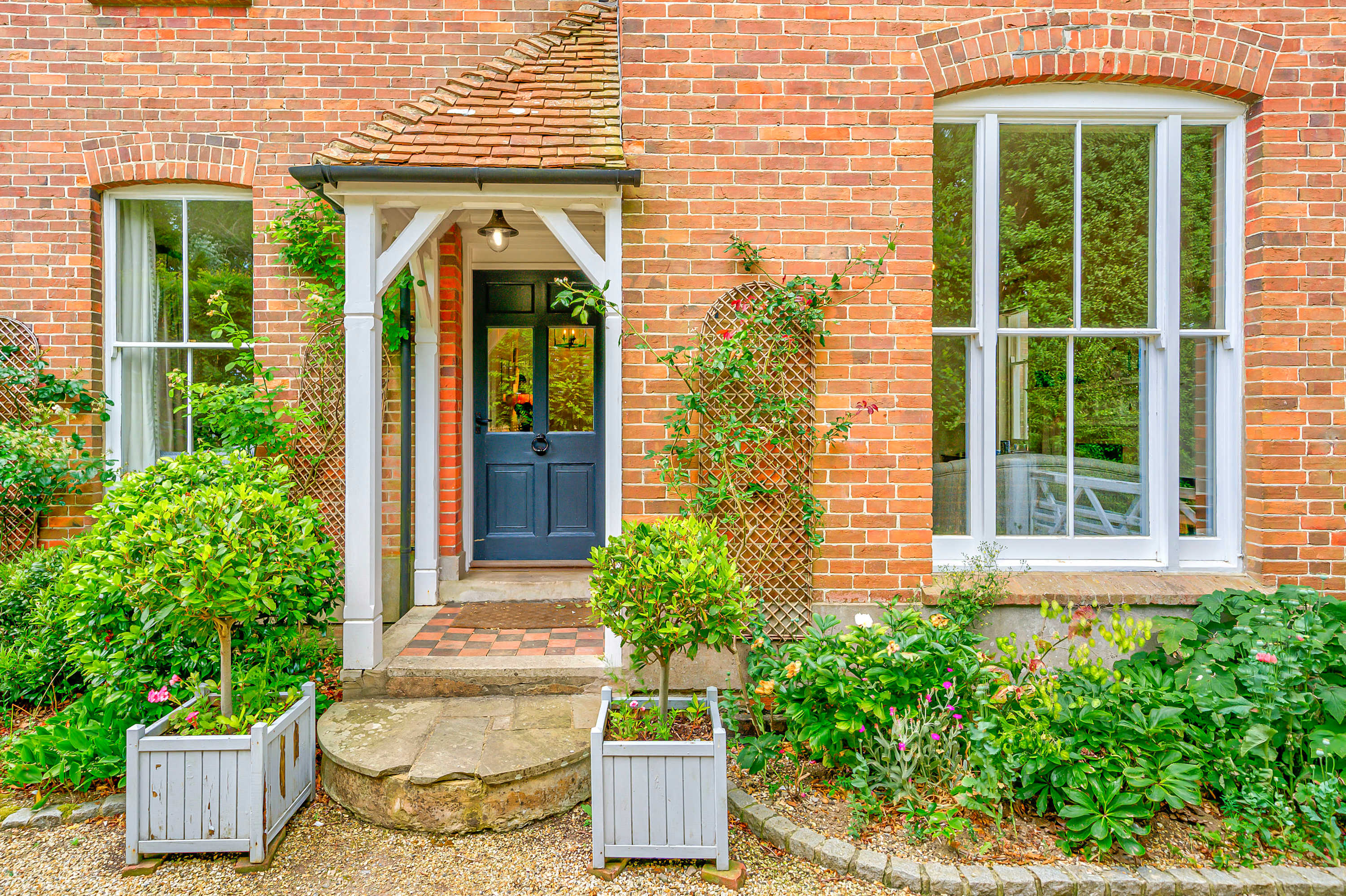 This property has large windows with step up access to the main front door.