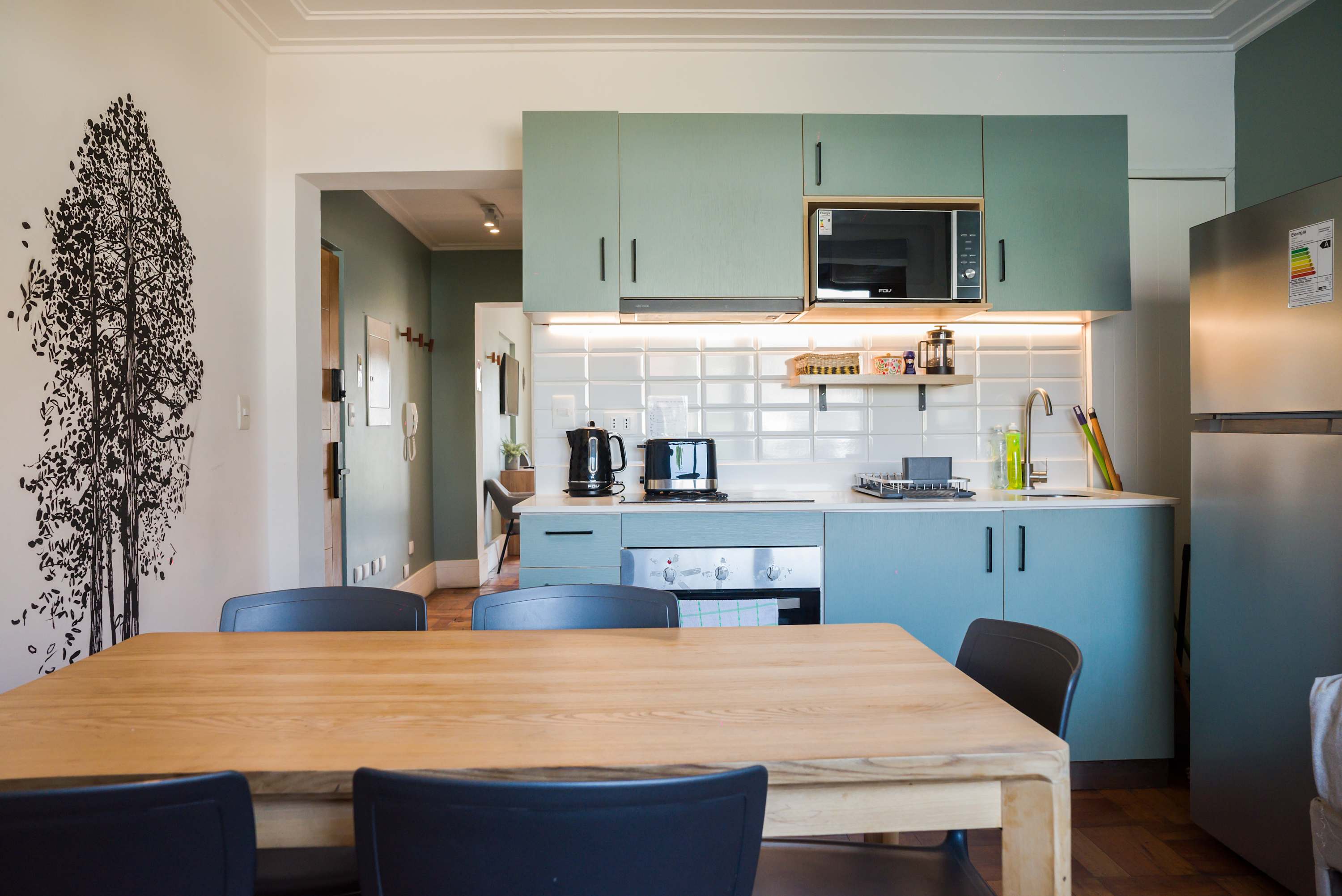 Charming kitchen with modern amenities and stylish decor, perfect for cooking and dining in comfort.