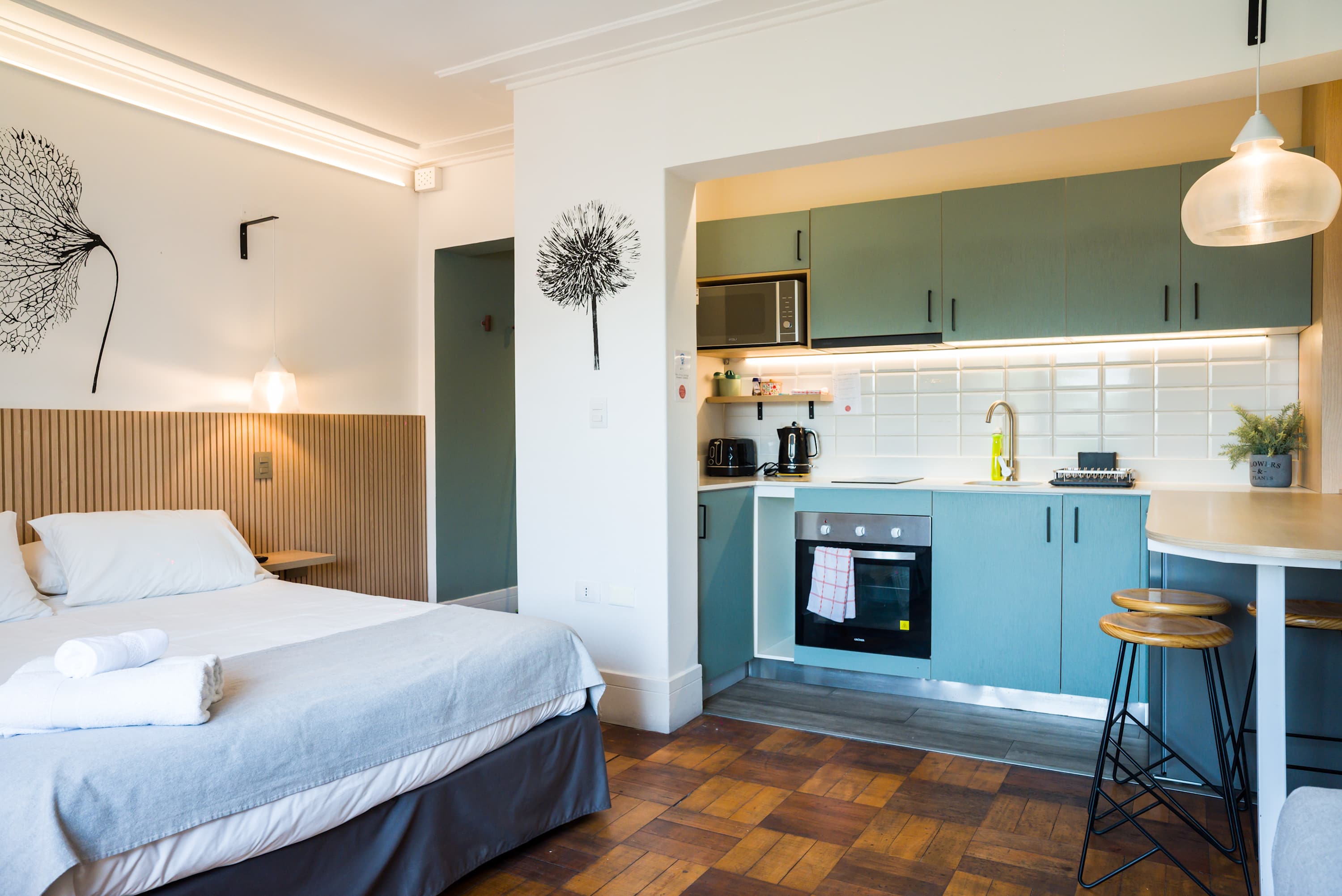 Chic studio with modern kitchen and cozy sleeping area, perfect for a relaxing stay in the heart of the city.