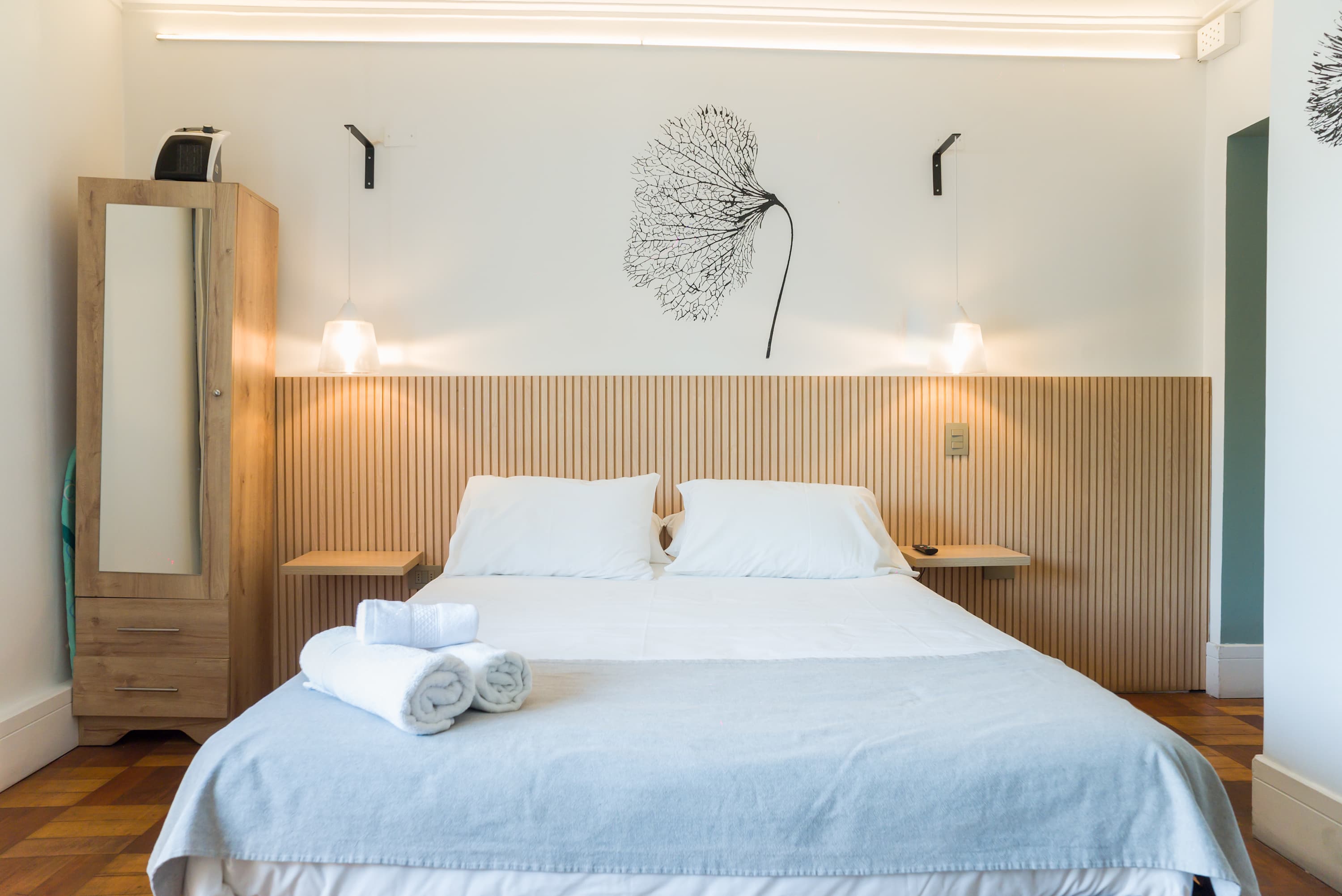 Cozy and stylish studio with comfortable bedding and modern decor, perfect for a relaxing stay.