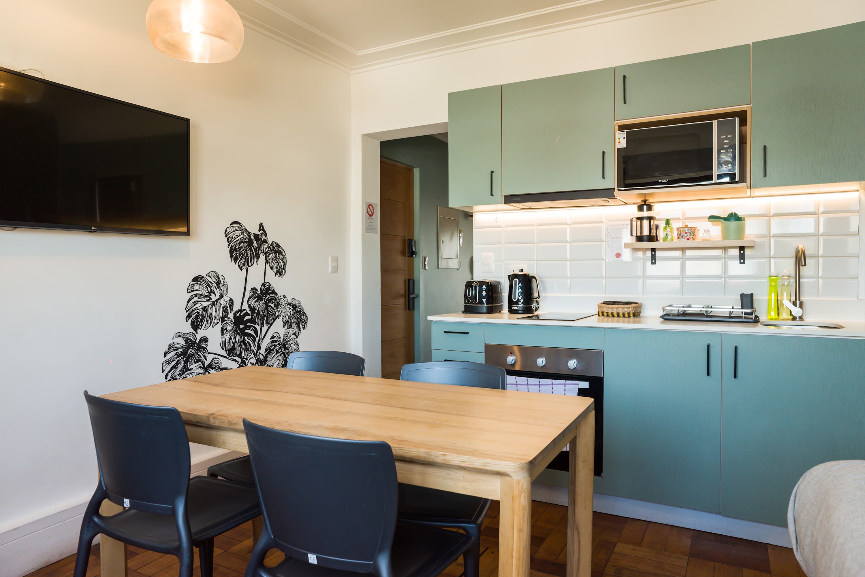 Cozy kitchen with modern amenities and stylish decor, perfect for intimate meals and relaxation.