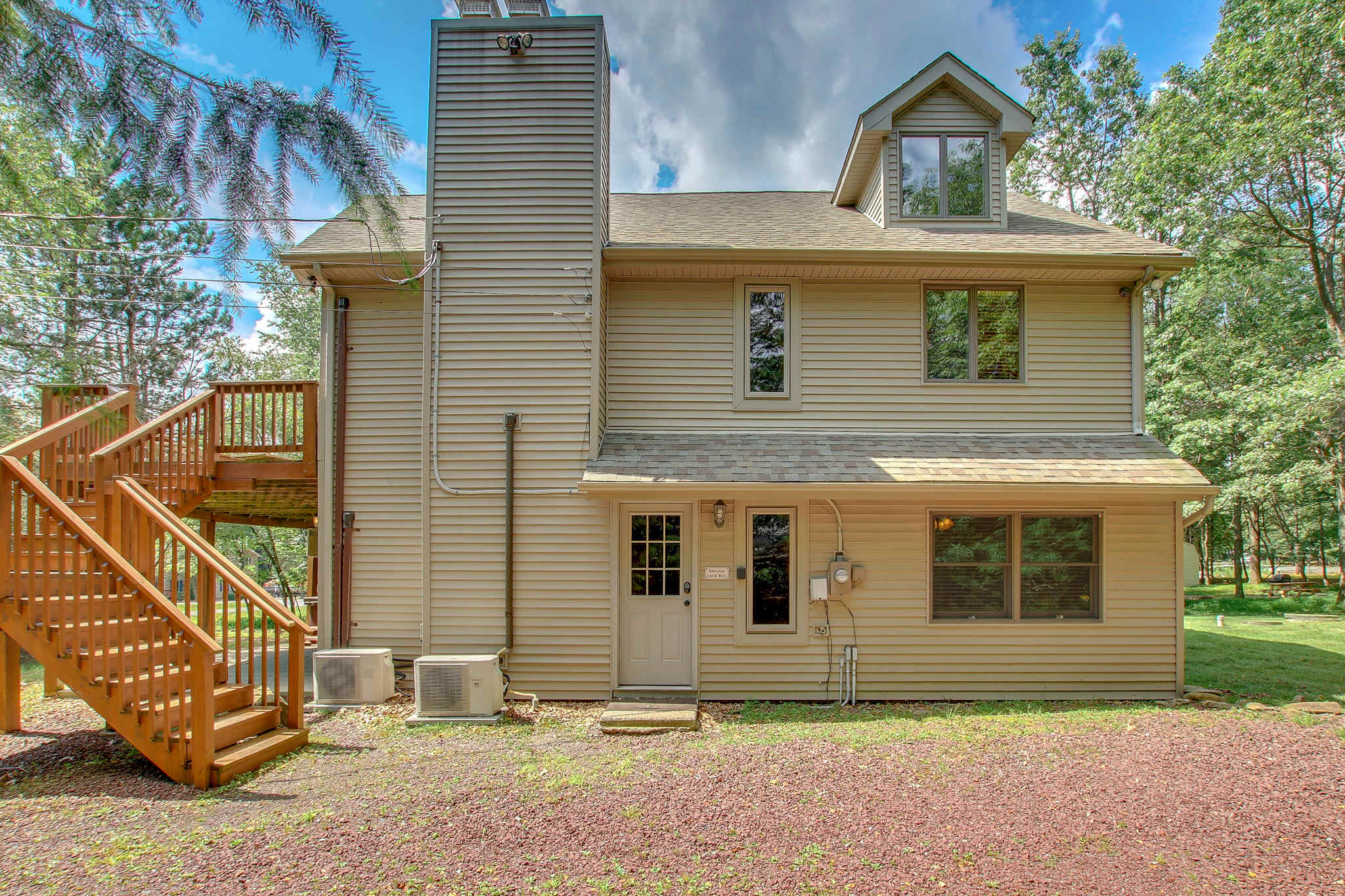 Multi-level chalet offers spacious deck access with views of the surrounding forest