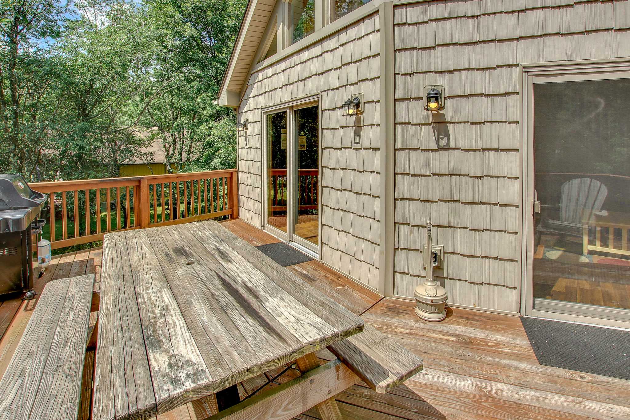 Slide open the door and step out to enjoy the fresh air and wooded serenity