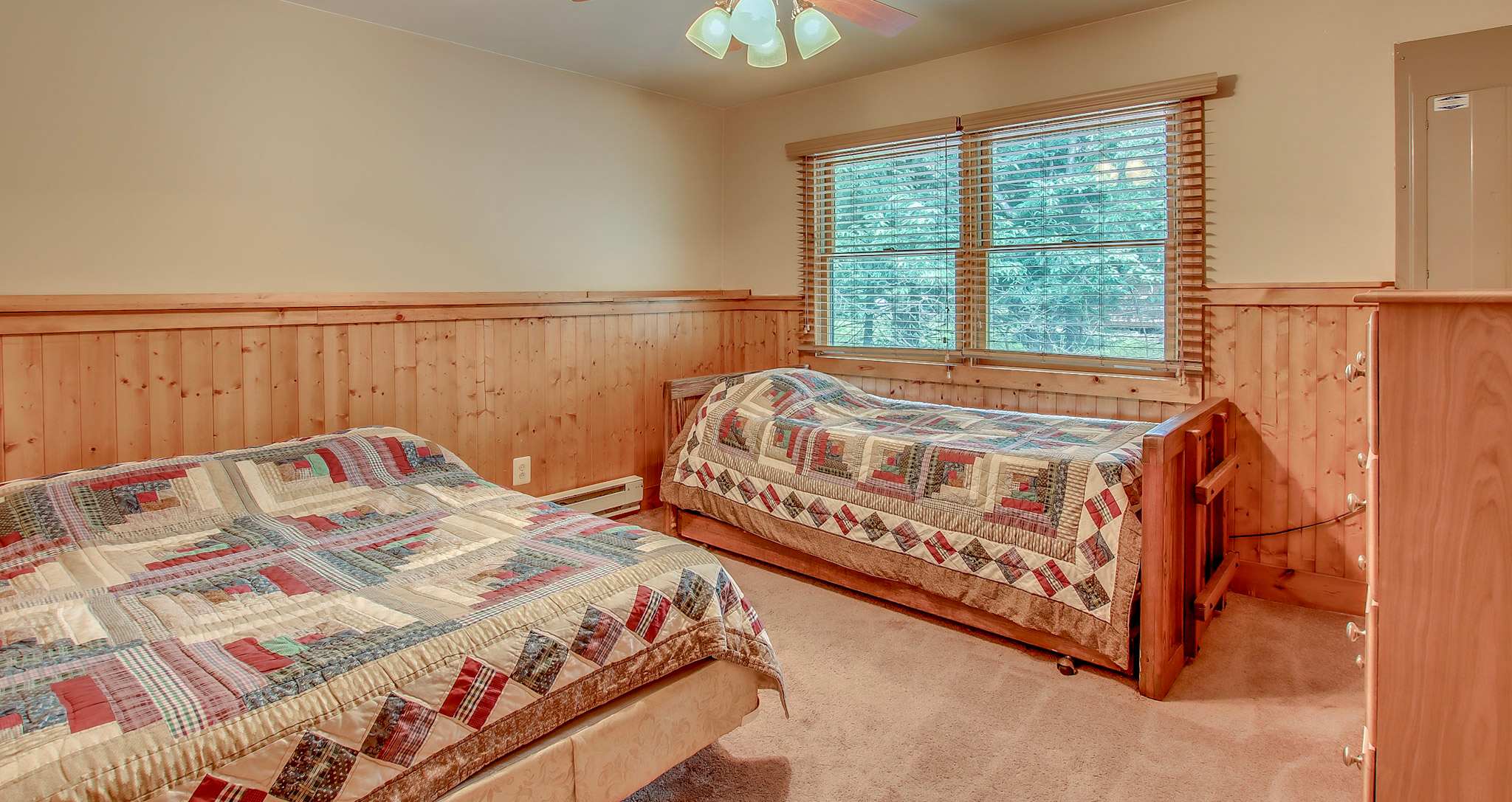 Cozy bedroom with trundle bed, perfect for kids or extra guests