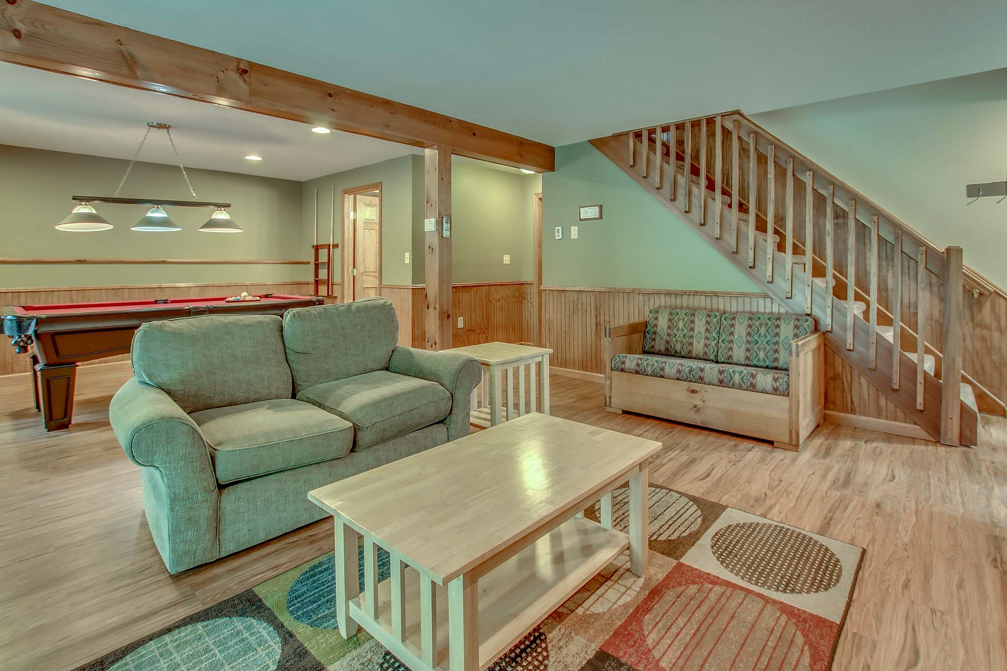 Challenge the family to a game of pool in the downstairs game room with cozy seating