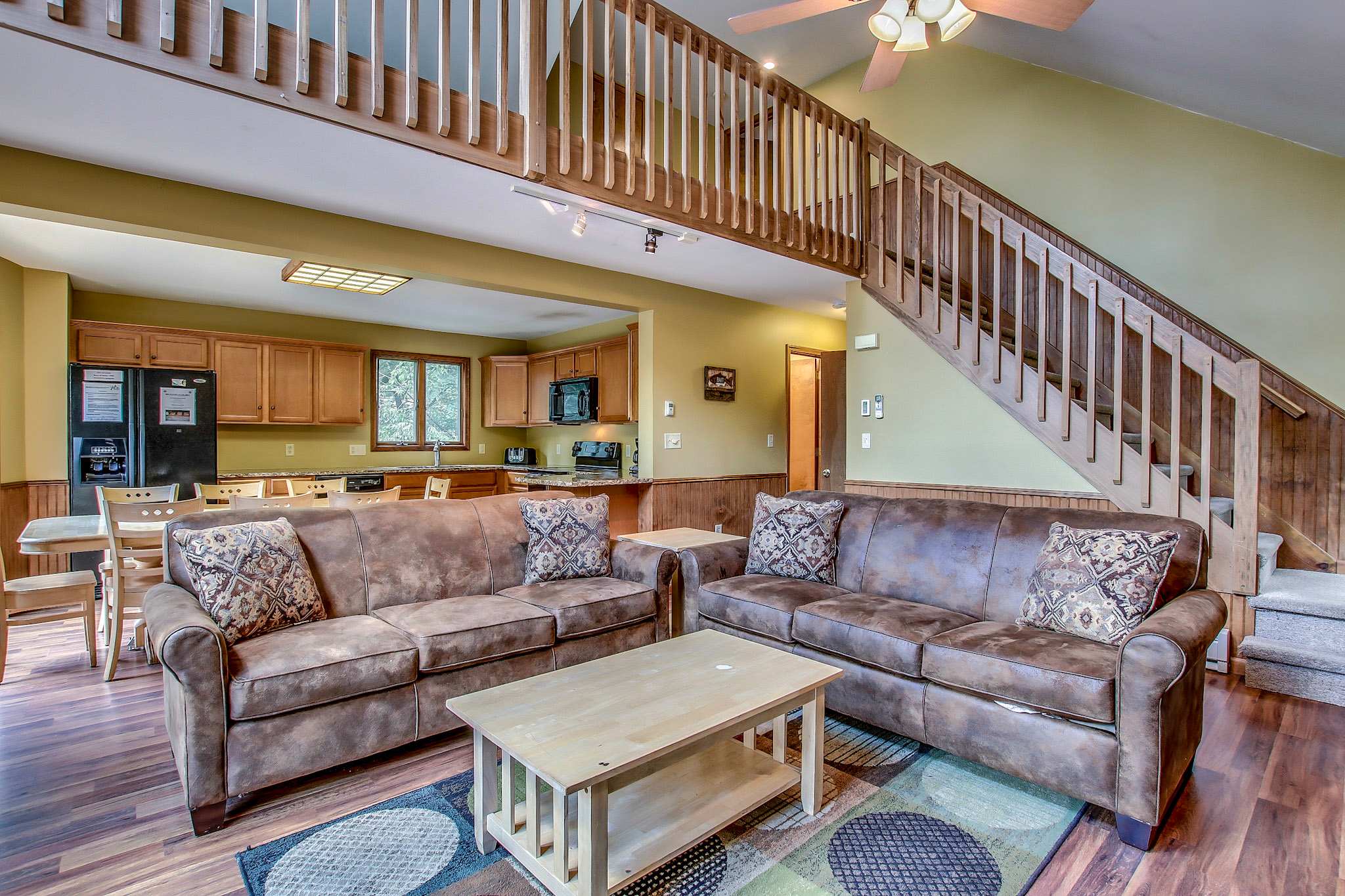 Sink into the couch and enjoy a movie by the stone fireplace after a day on the trails