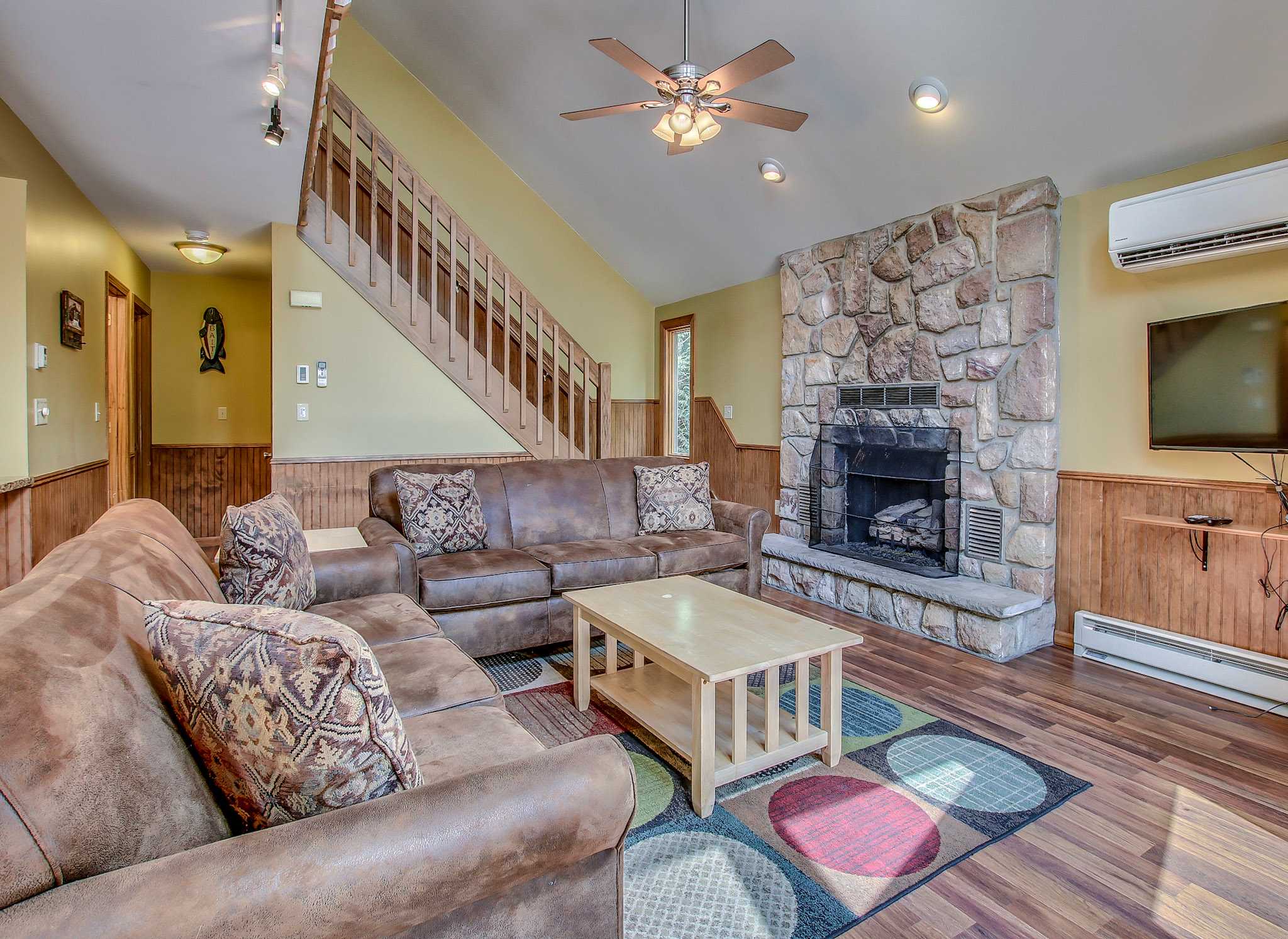 Colorful accents and warm wood tones create a welcoming living space for all