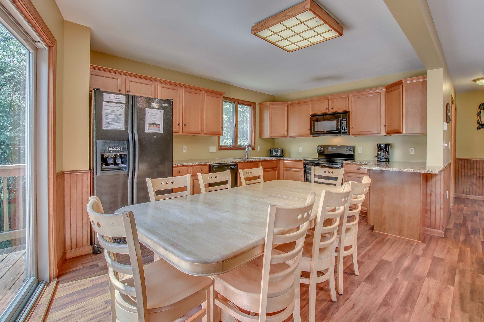 Spacious dining area seats six for family meals, with a fully equipped kitchen steps away