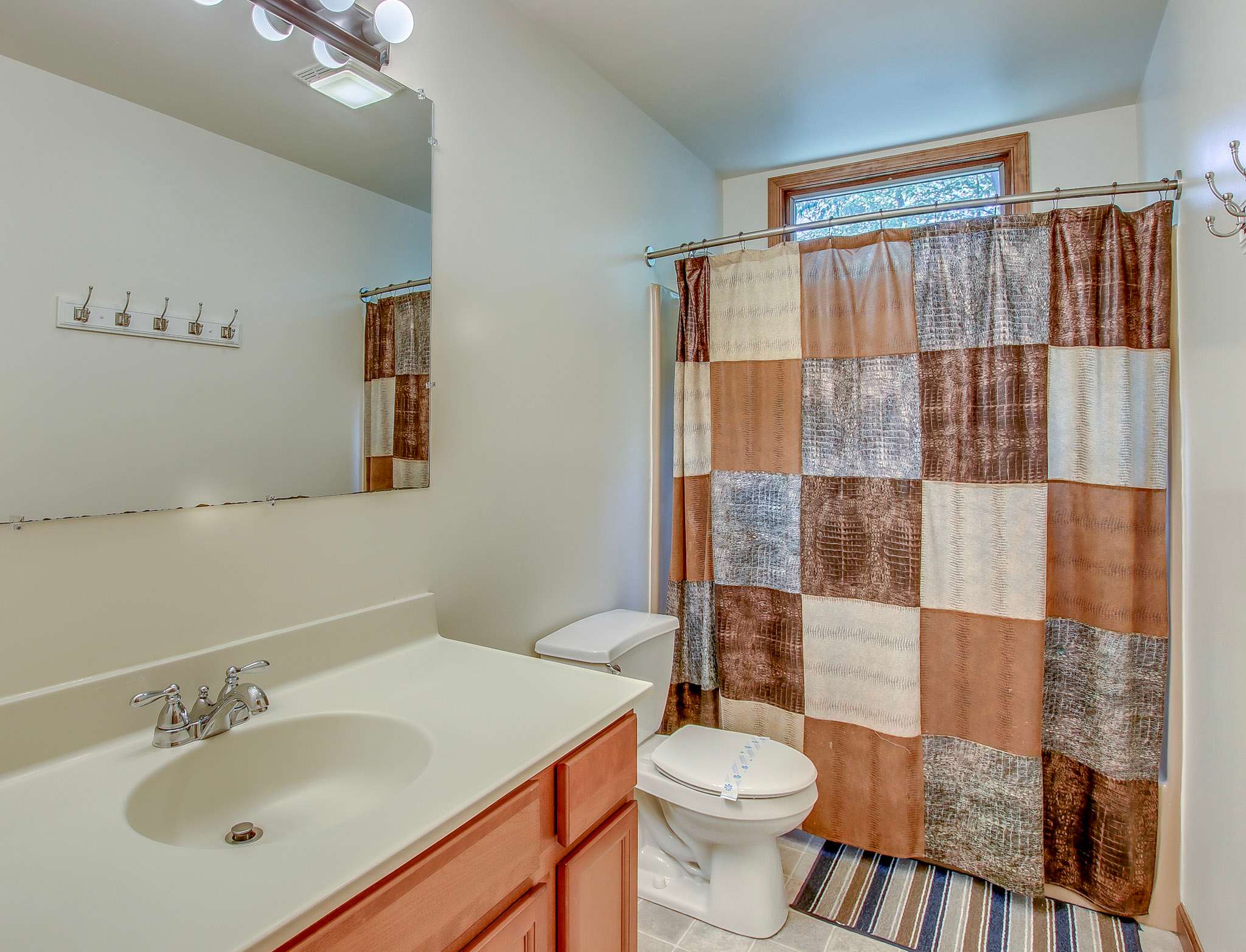 Full bathroom with tub and shower combo, perfect for freshening up after outdoor adventures