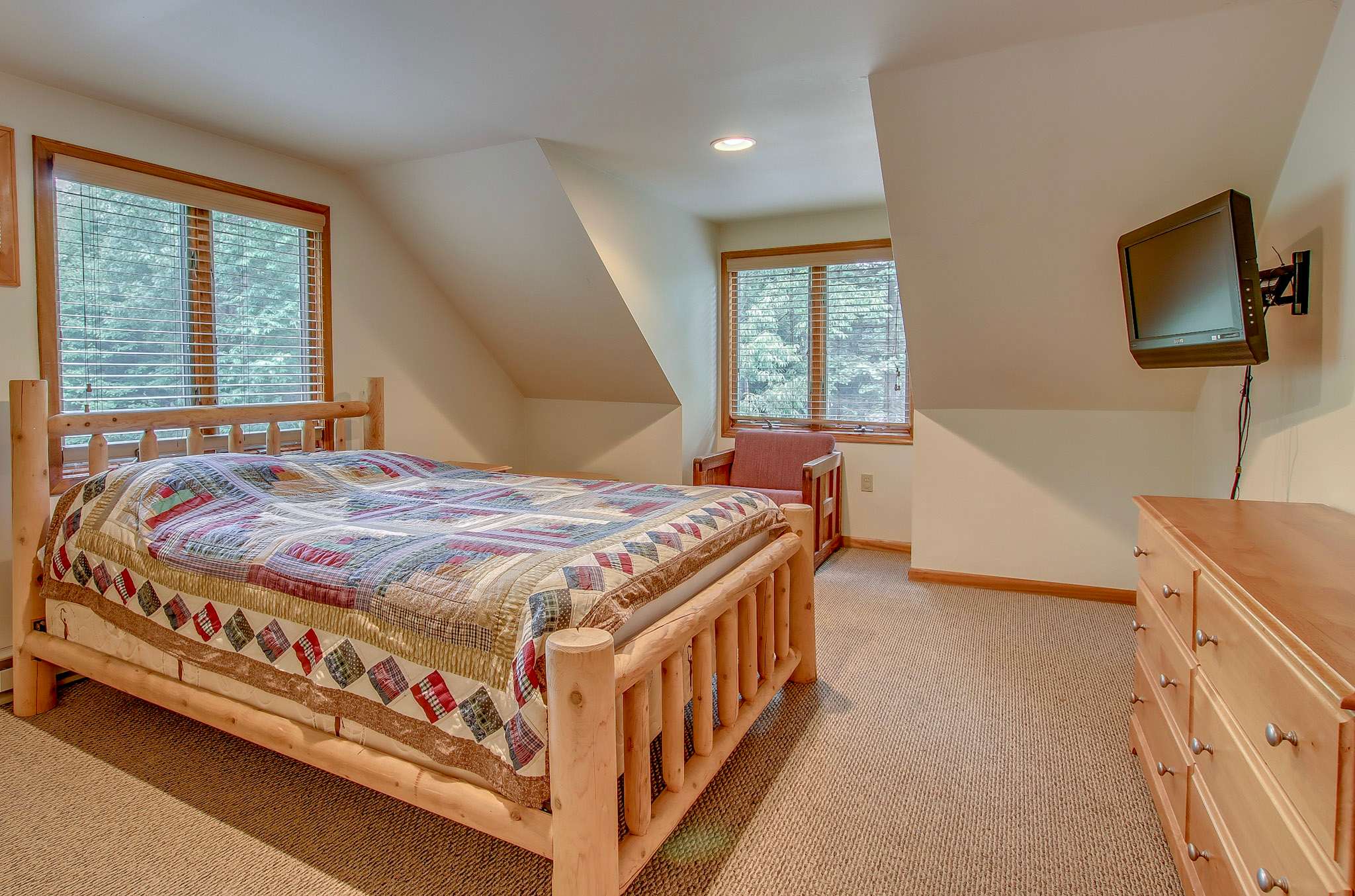 Loft retreat features a TV and cozy seating area for quiet evenings upstairs