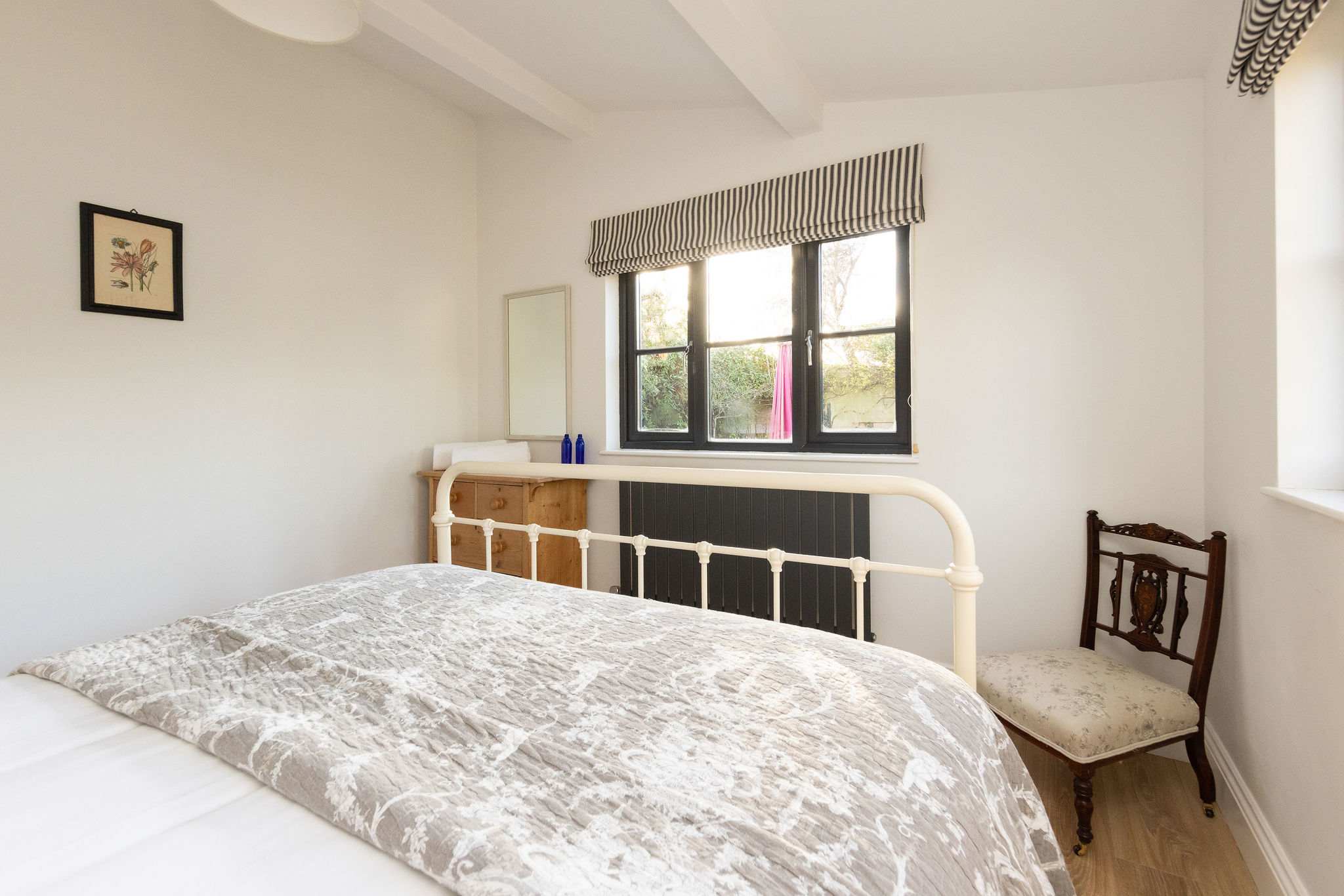 Bright double bedroom with garden views