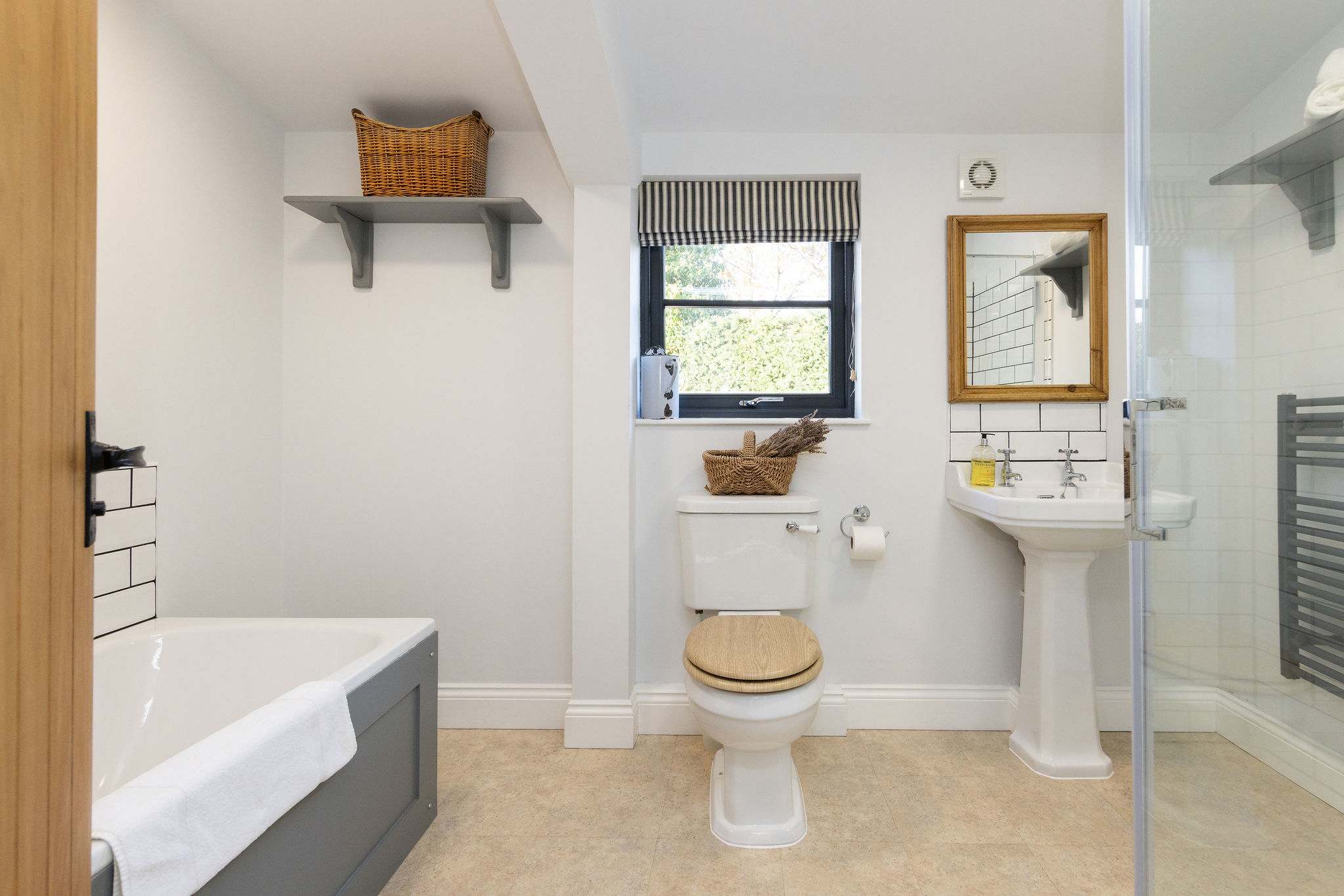 Spacious bathroom with bath, shower, w.c and basin