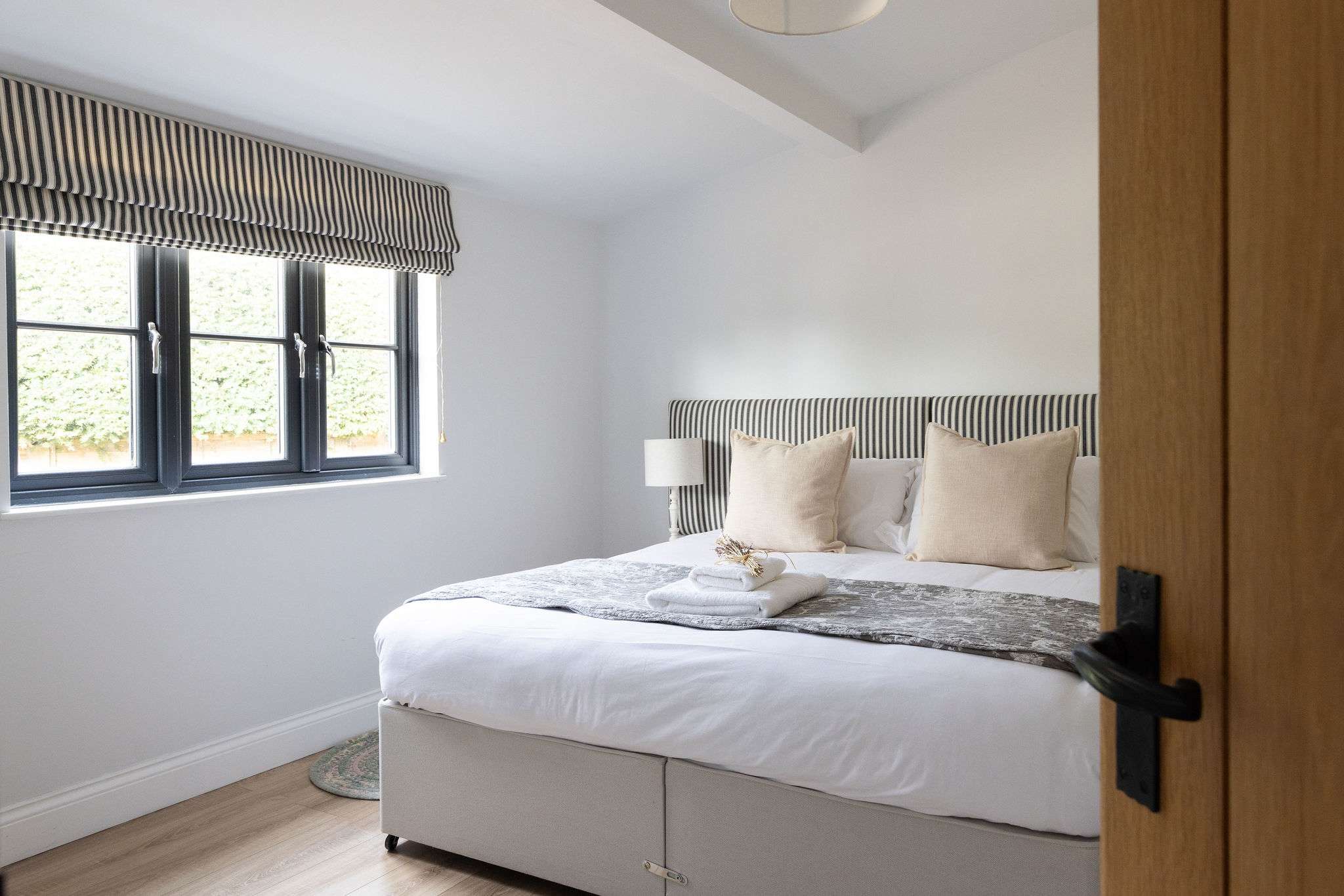 Double bedroom with striped headboard
