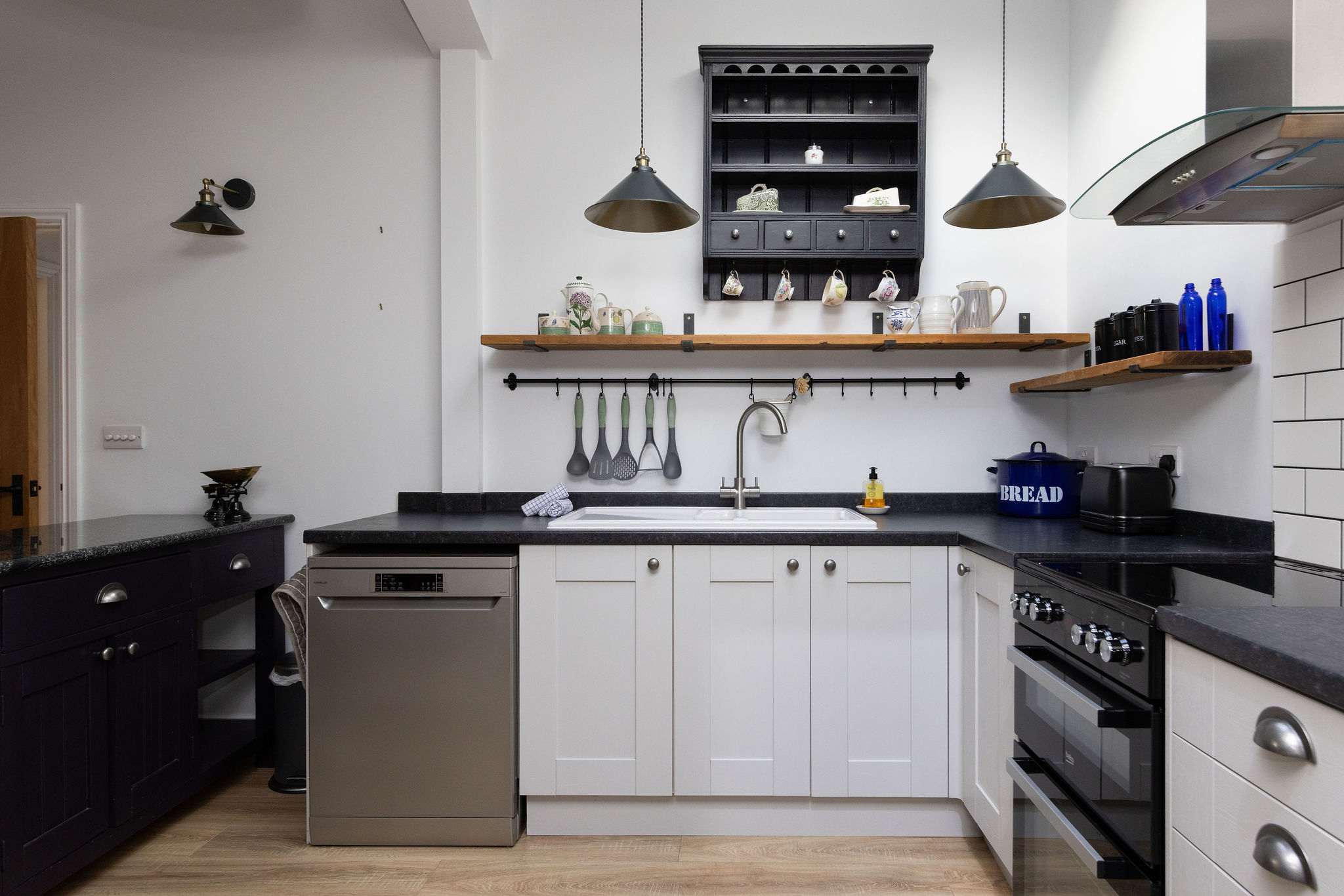 Kitchen with dishwasher and range oven