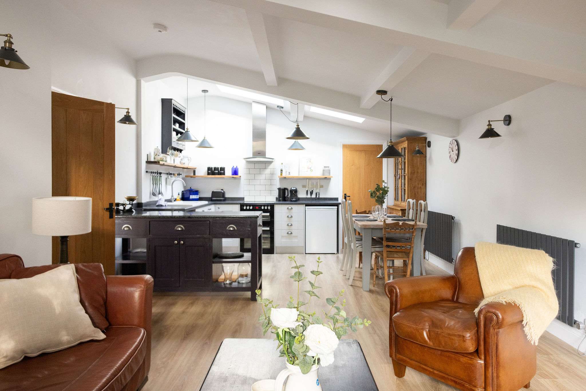 Head into the inviting annexe with the warm open plan living space.