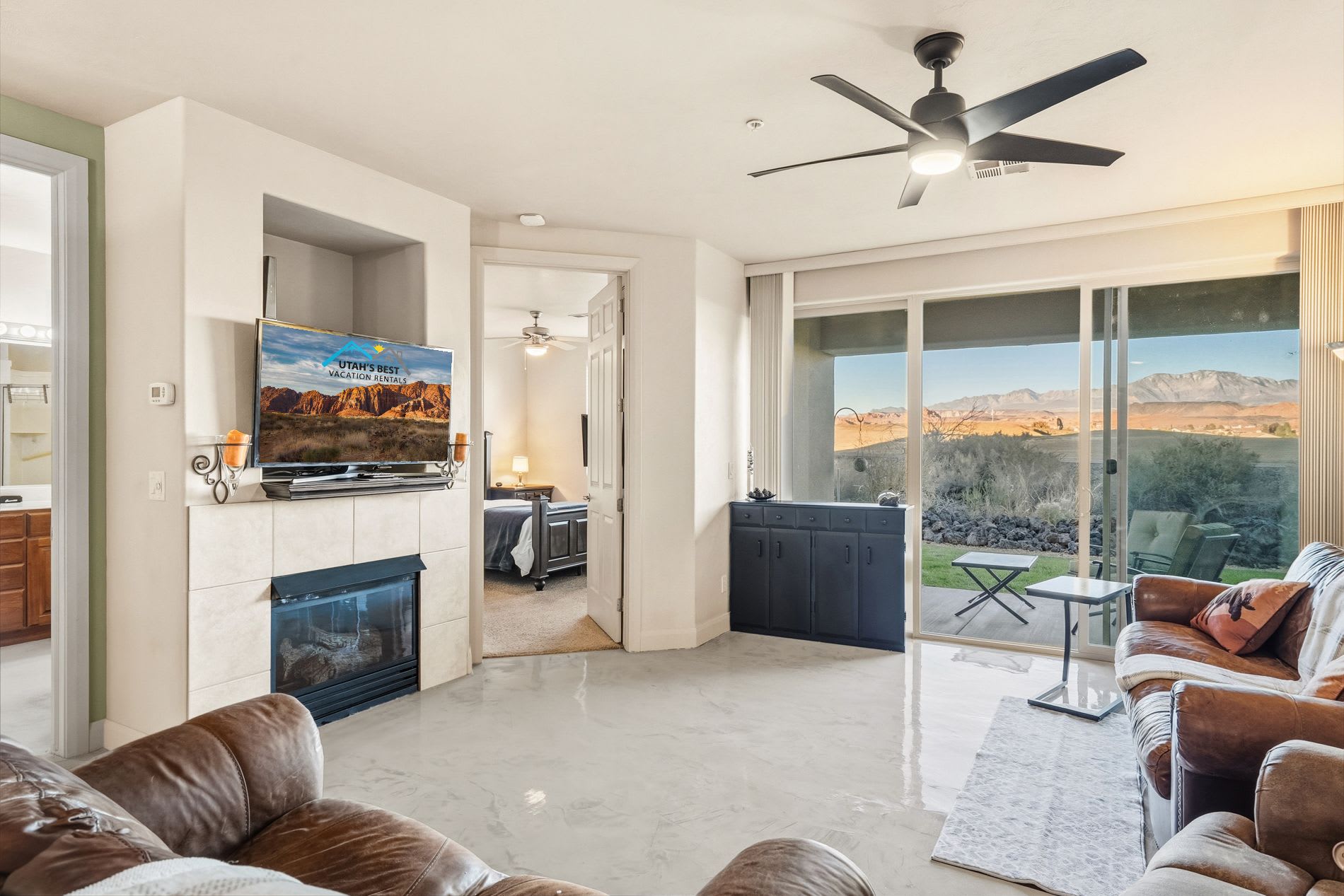 Relax in the comfort of this bright living space with panoramic views of St. George’s red rock landscape.