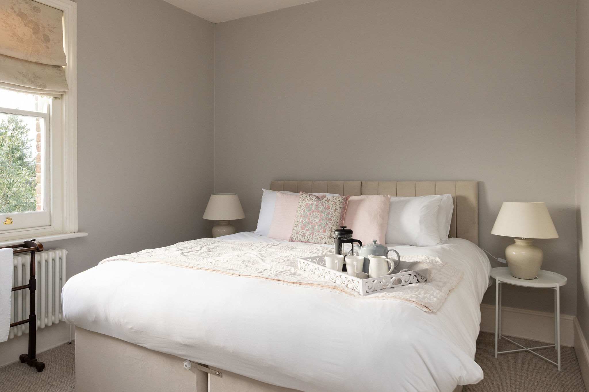 Light and calming master bedroom with superking bed