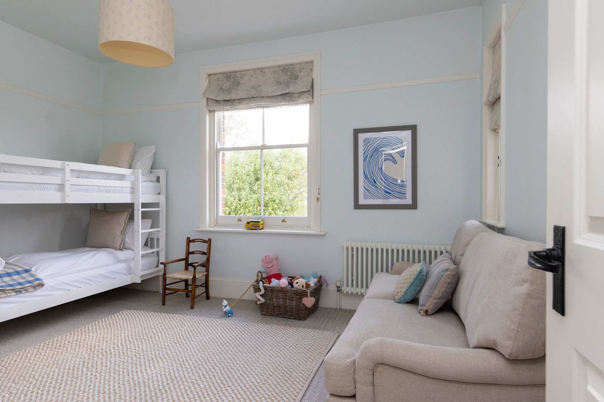 Kids bedroom with bunk beds and pull out sofa bed