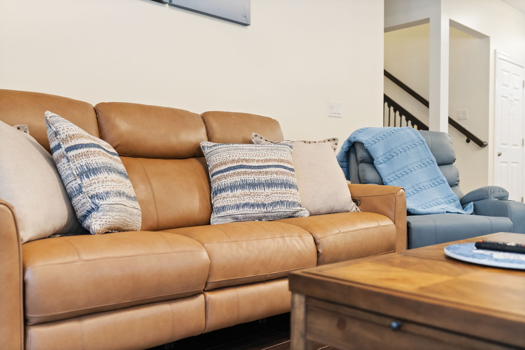 Comfortable leather sofa with accent pillows - sink in and relax after exploring the Poconos