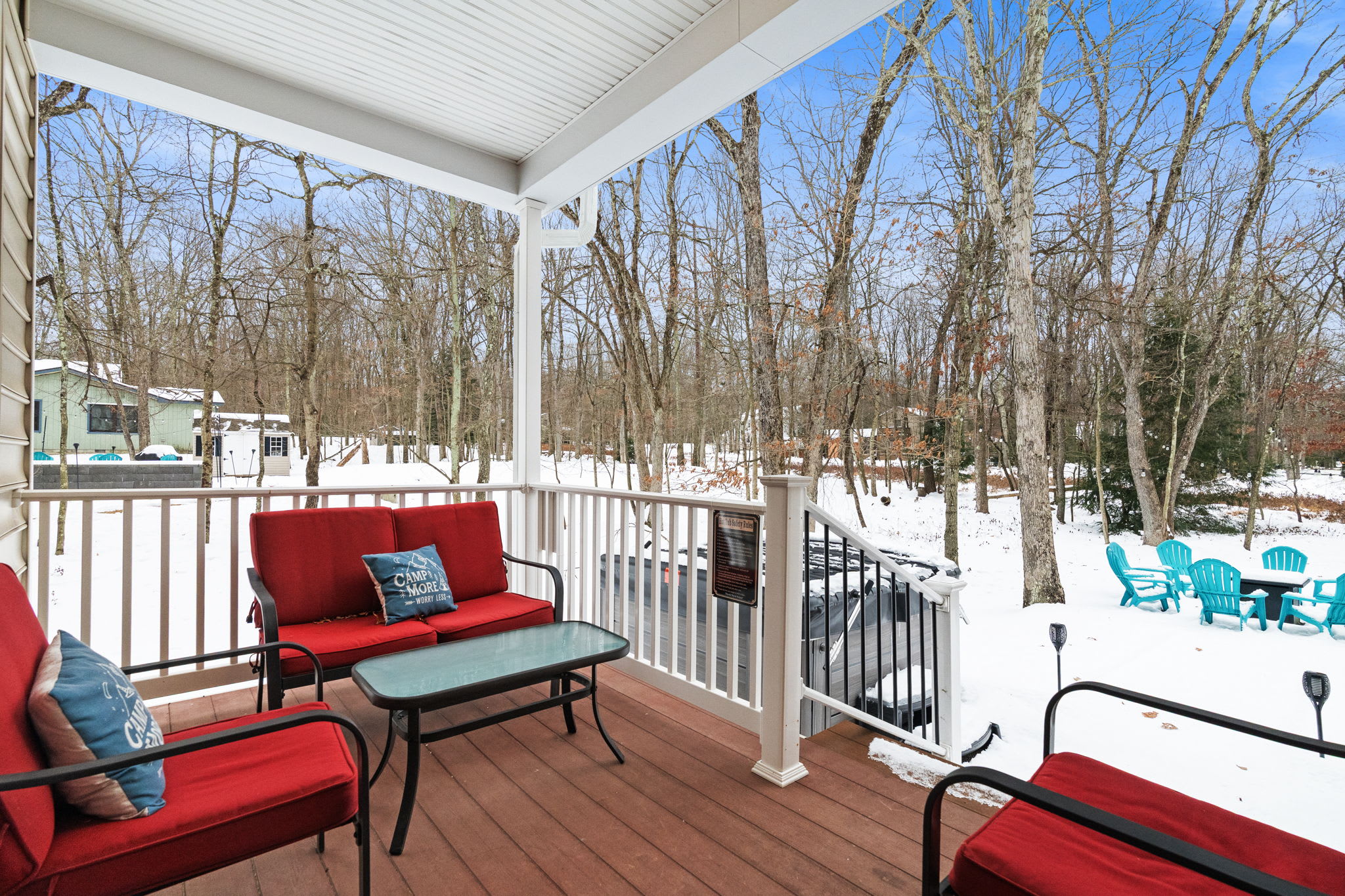 Wrap-around deck with comfortable outdoor seating - enjoy peaceful views of the Pocono Mountains forest