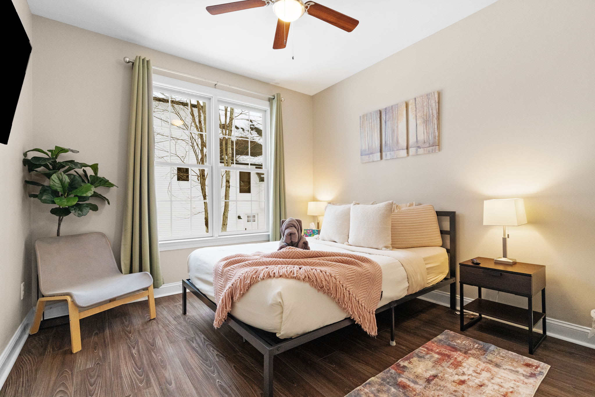 Elegant third bedroom with queen bed, stylish decor and natural light - peaceful retreat in the Poconos