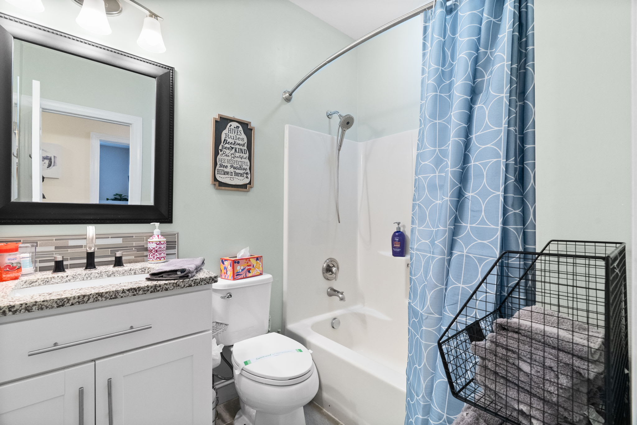 Modern full bathroom with sleek fixtures, shower and stylish tile design in Poconos cabin