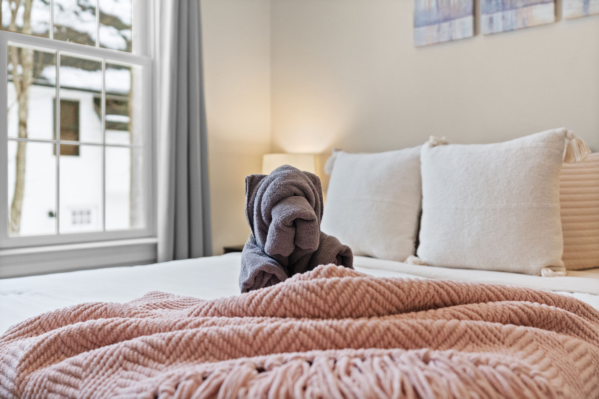 Inviting third bedroom retreat with luxurious bedding and relaxing ambiance for guests