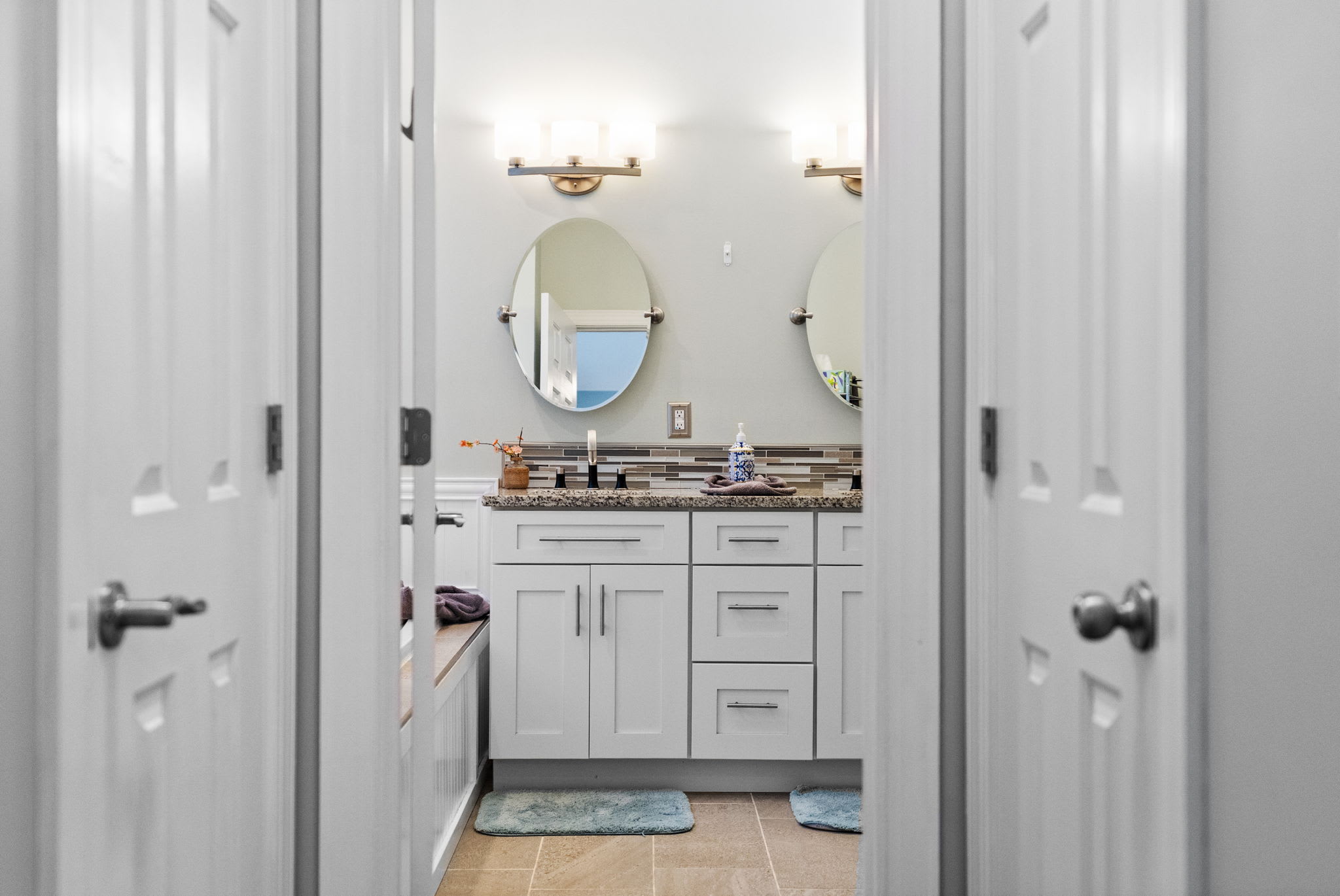 Bright second bathroom with modern white fixtures and clean tile design in Poconos vacation rental