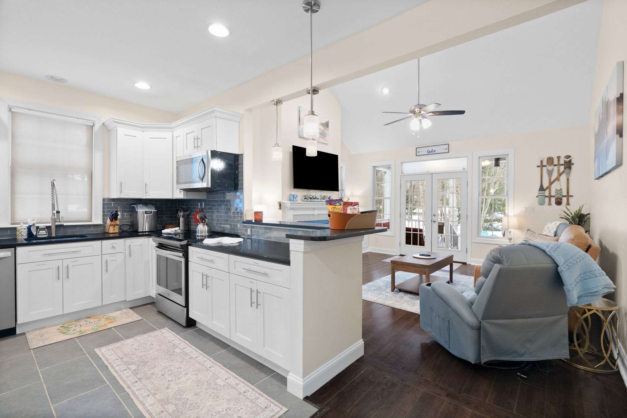 Bright modern kitchen with white cabinetry, stainless appliances and everything you need to prepare meals