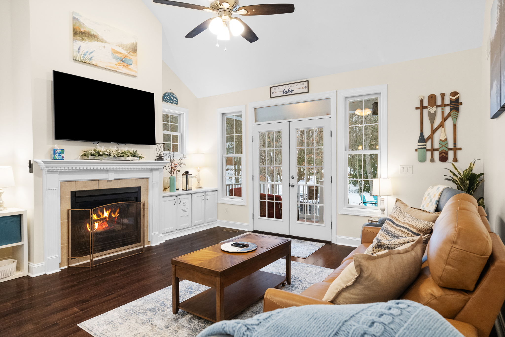 Inviting living space with ceiling fan and natural wood accents - relax after a day of Poconos adventures