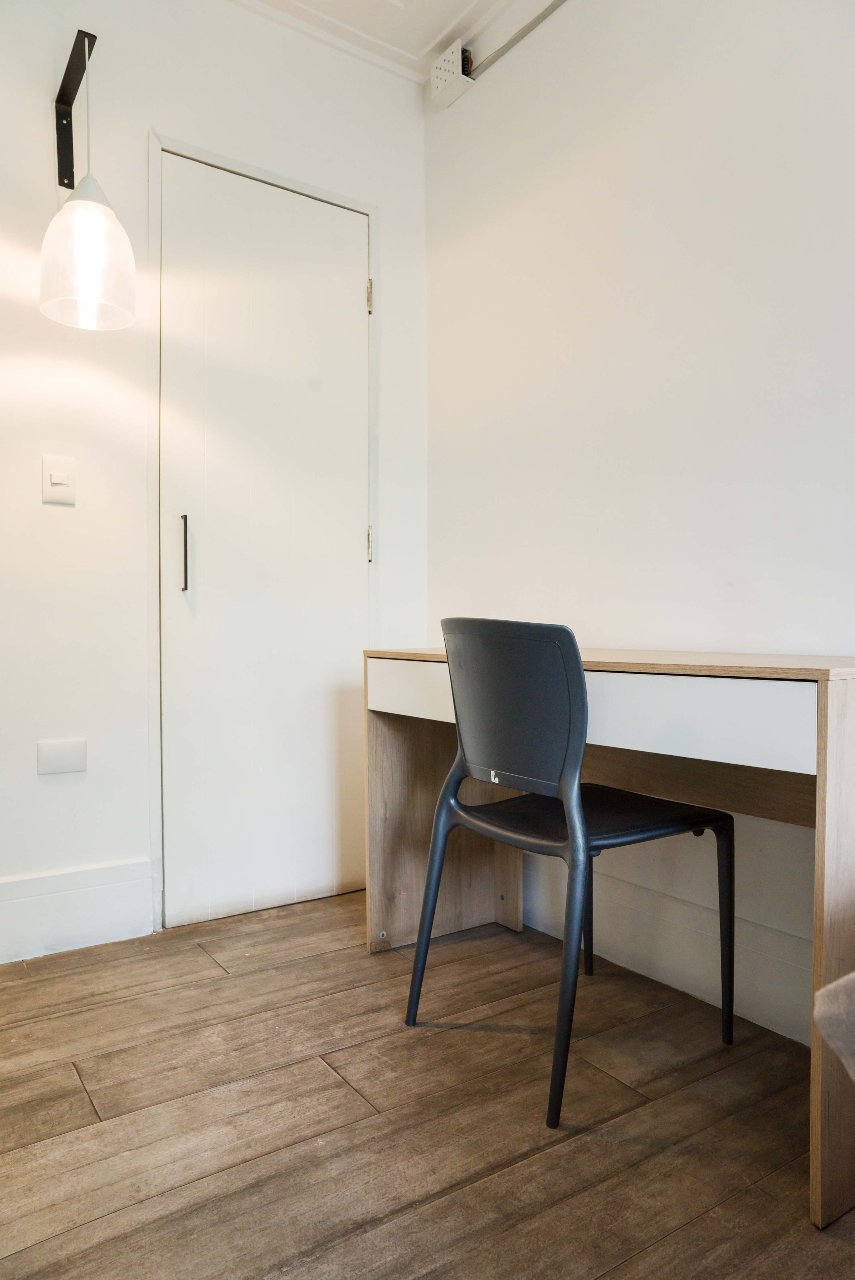 Cozy workspace with modern lighting and sleek design, perfect for remote work or study sessions.