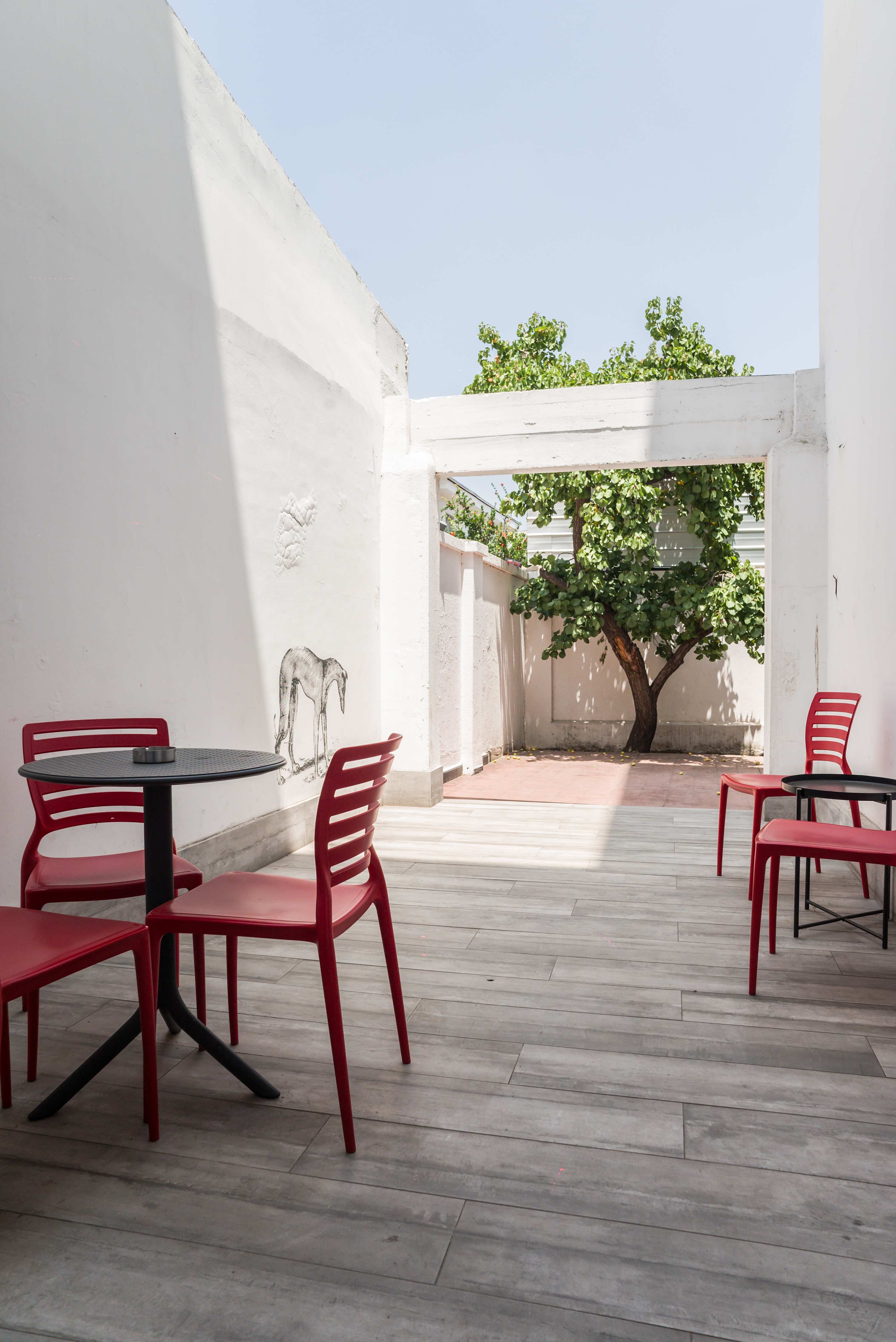 Relax in this bright outdoor patio, perfect for enjoying a morning coffee or evening breeze.