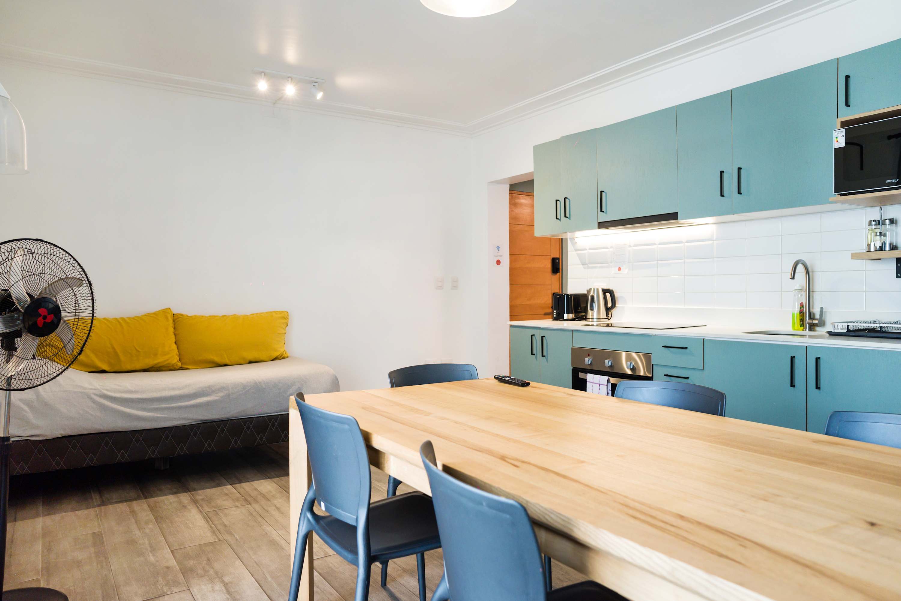 Bright and modern kitchen with dining area, perfect for family meals and gatherings.