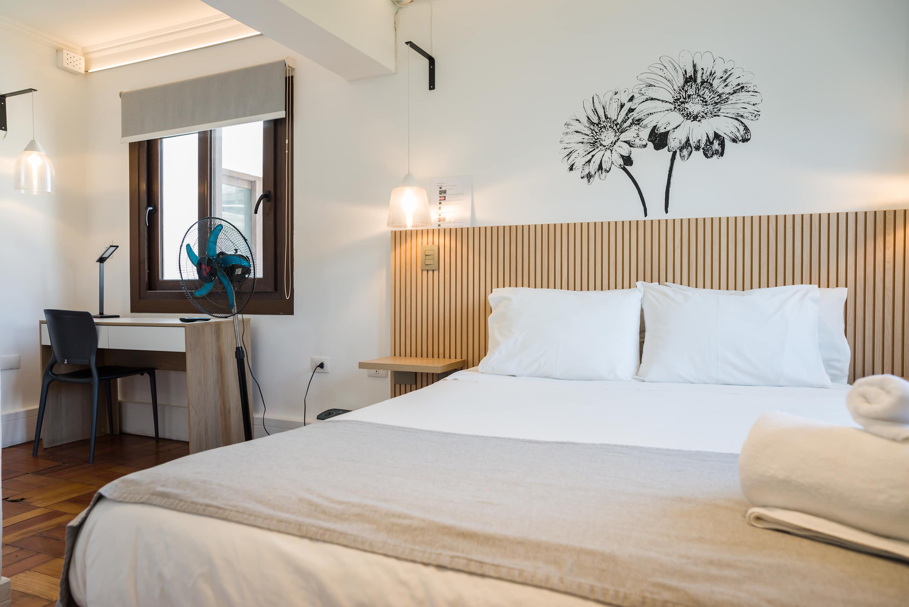 Cozy studio with a comfortable bed and workspace, perfect for a relaxing stay in the heart of Chile.