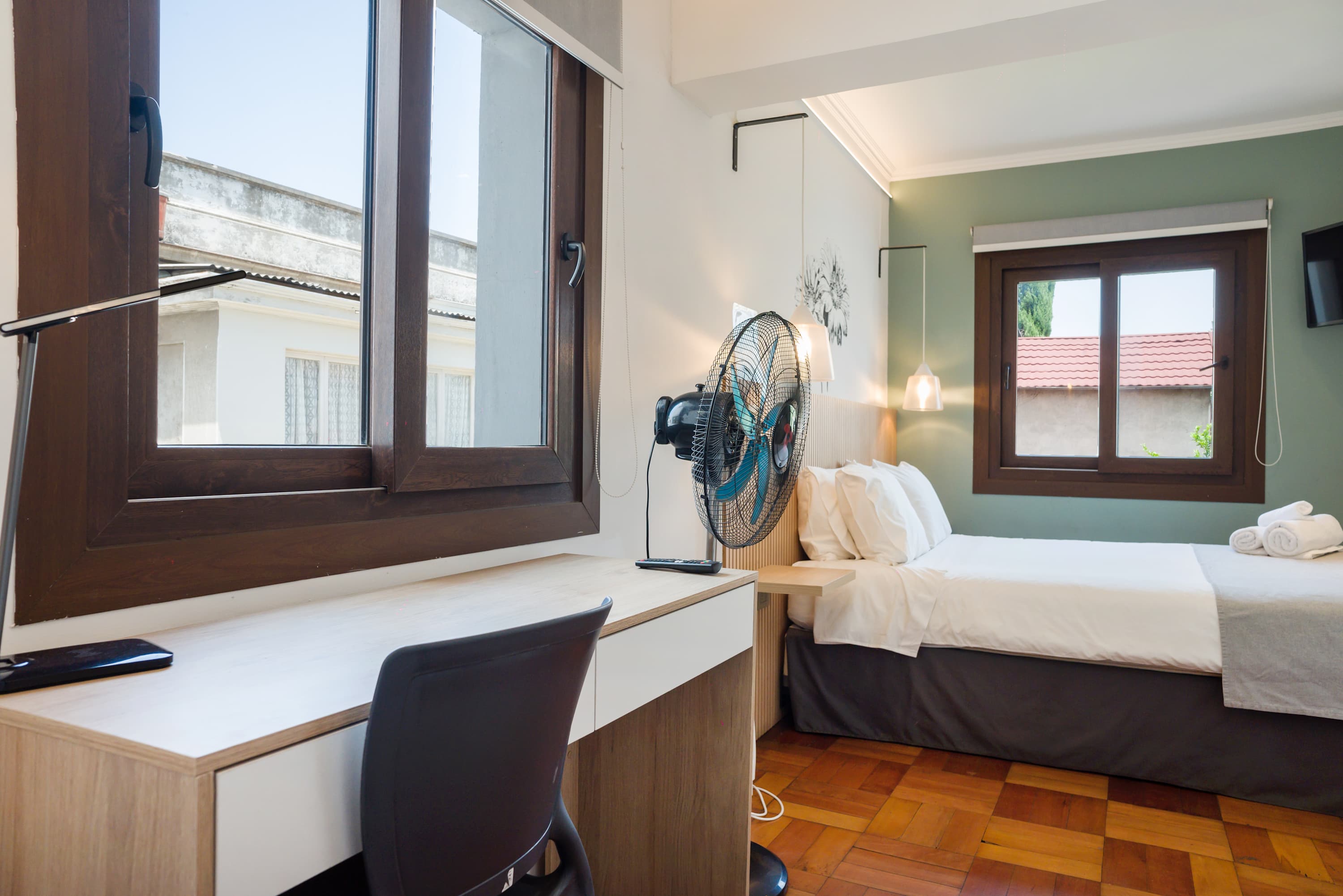 Bright and cozy studio with natural light, perfect for relaxation and work.