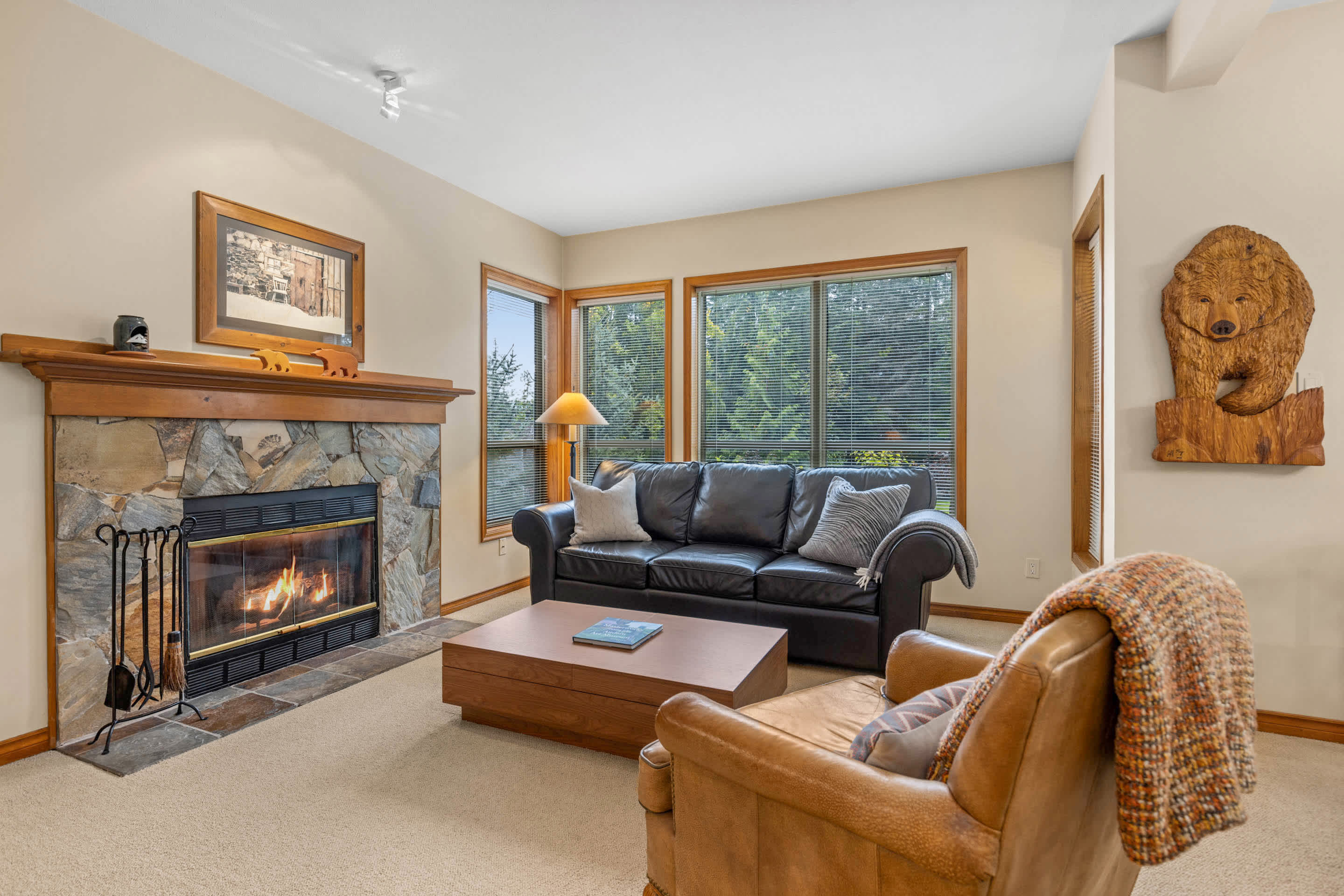 - Inviting living room with mountain views and warm fireplace 
- Comfortable seating perfect for relaxing after outdoor adventures 
- Whistler vacation rental with cozy alpine charm