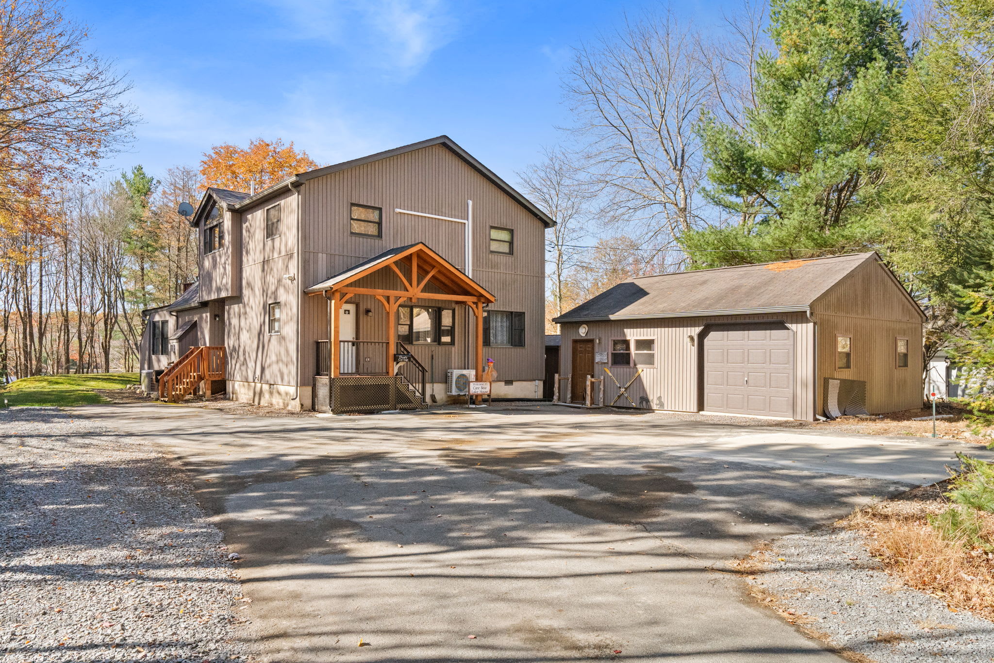 Front entrance with attached two-car garage and additional parking - secure and convenient vehicle storage