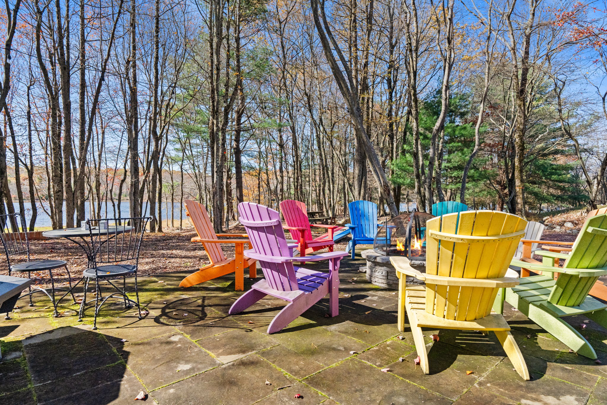 Covered firewood storage shed with ample wood supply - ready for cozy evenings by the fireplace