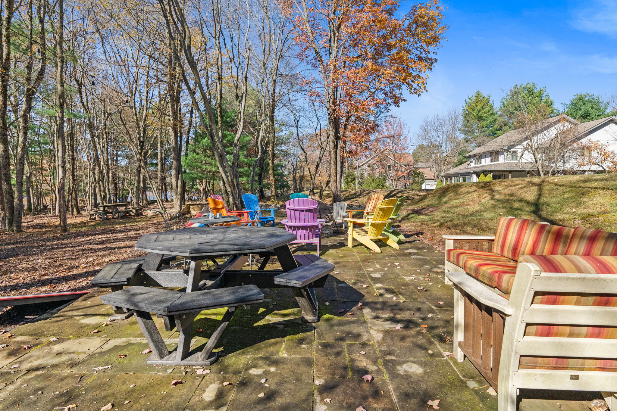Scenic lakefront property with natural wooded setting - peaceful retreat atmosphere throughout the grounds