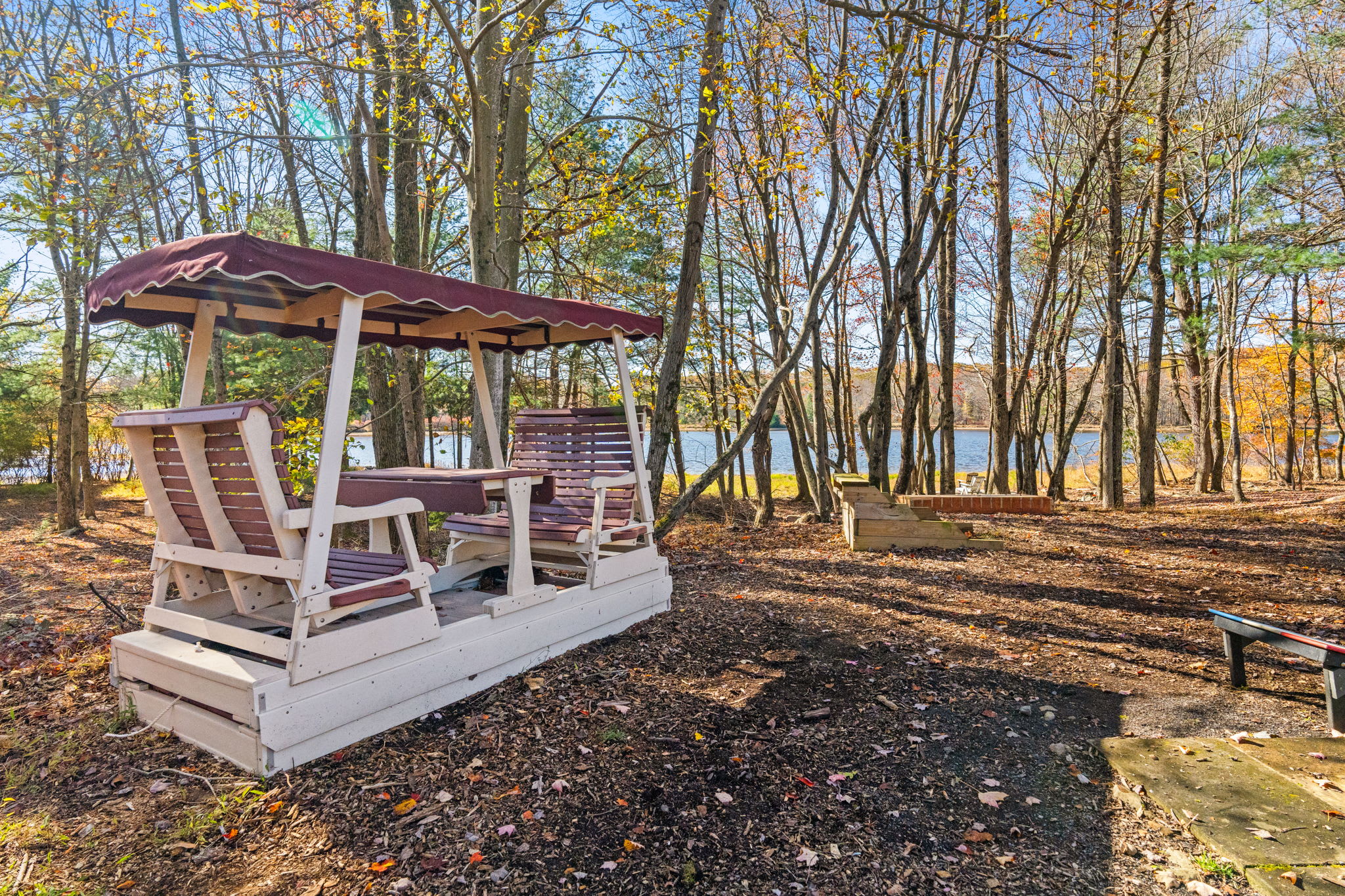 Picnic area with table and playground equipment - versatile outdoor space for dining and children's activities