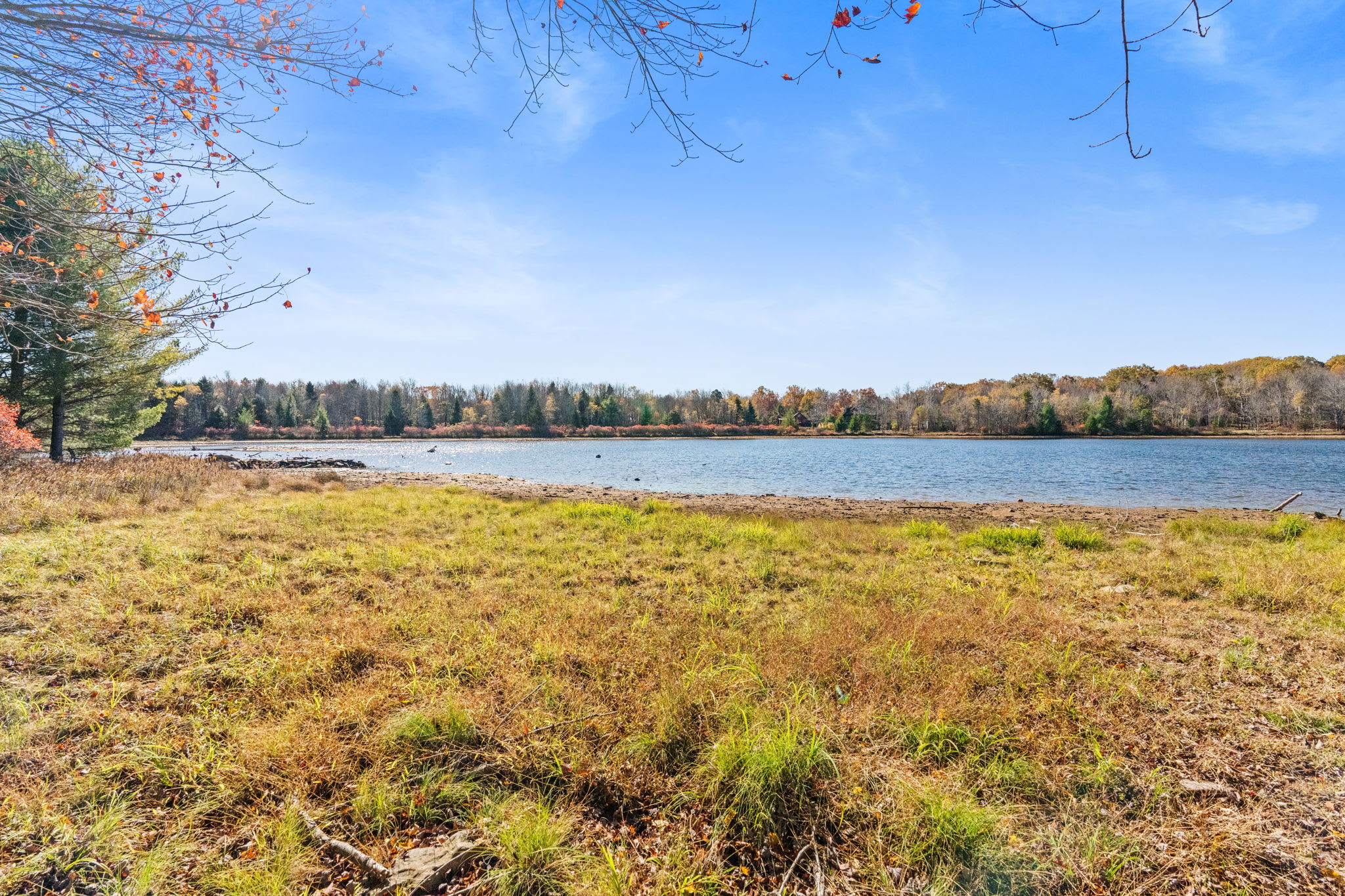 Lakefront community setting with sandy shores - enjoy scenic lake views and nearby water recreation