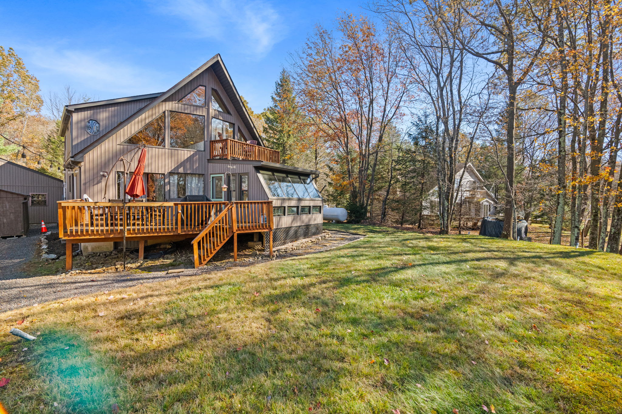 Lush front lawn with mature trees and open space - plenty of room for outdoor activities and relaxation