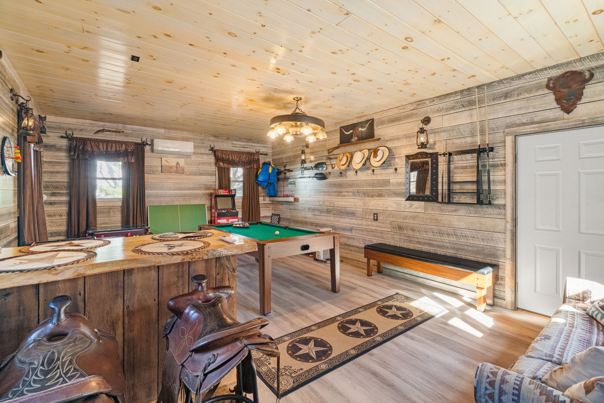 Open-concept great room with sofa seating and wood accents - comfortable living space with mountain charm