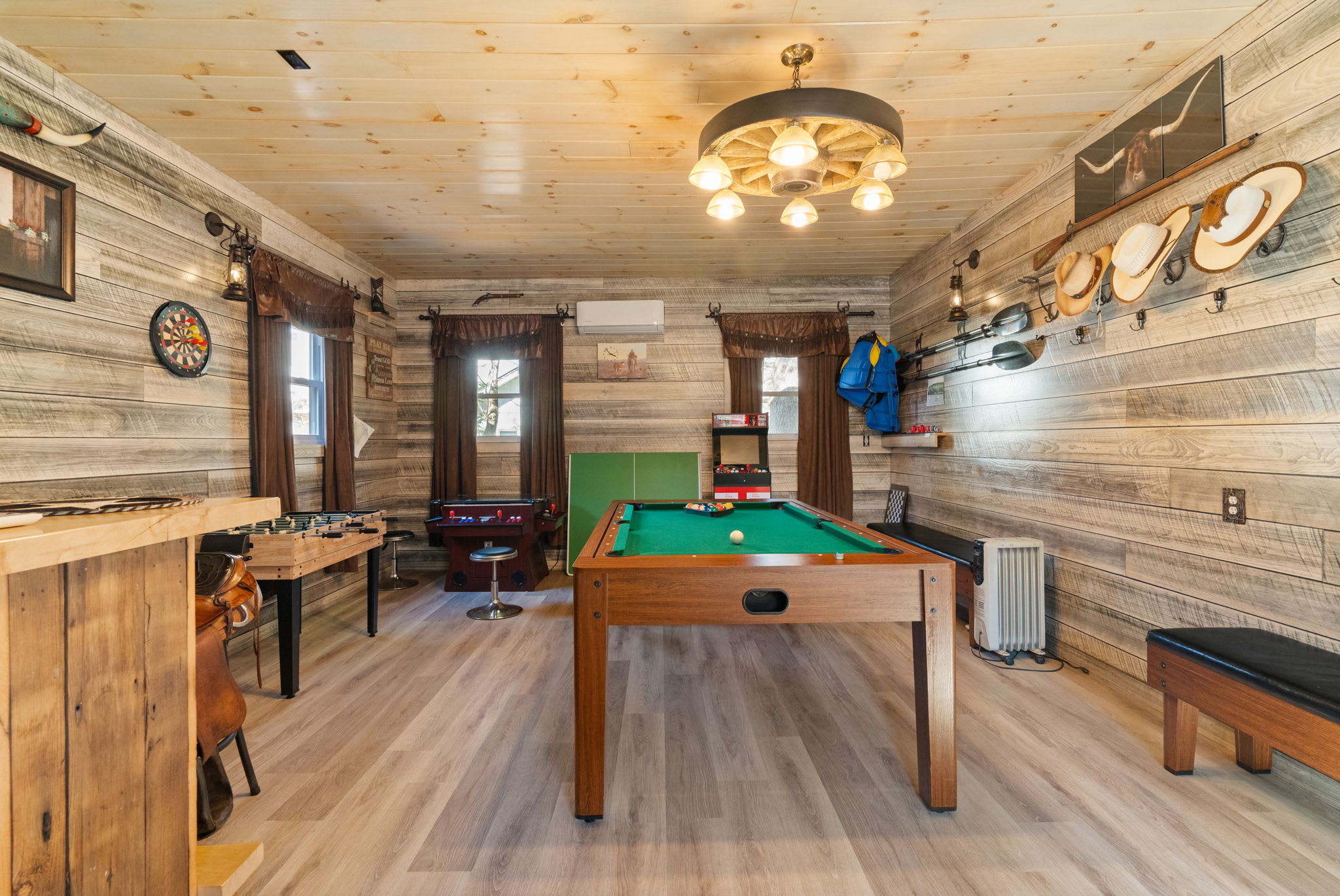 Living room with pool table for entertainment - great space for family game nights and indoor fun