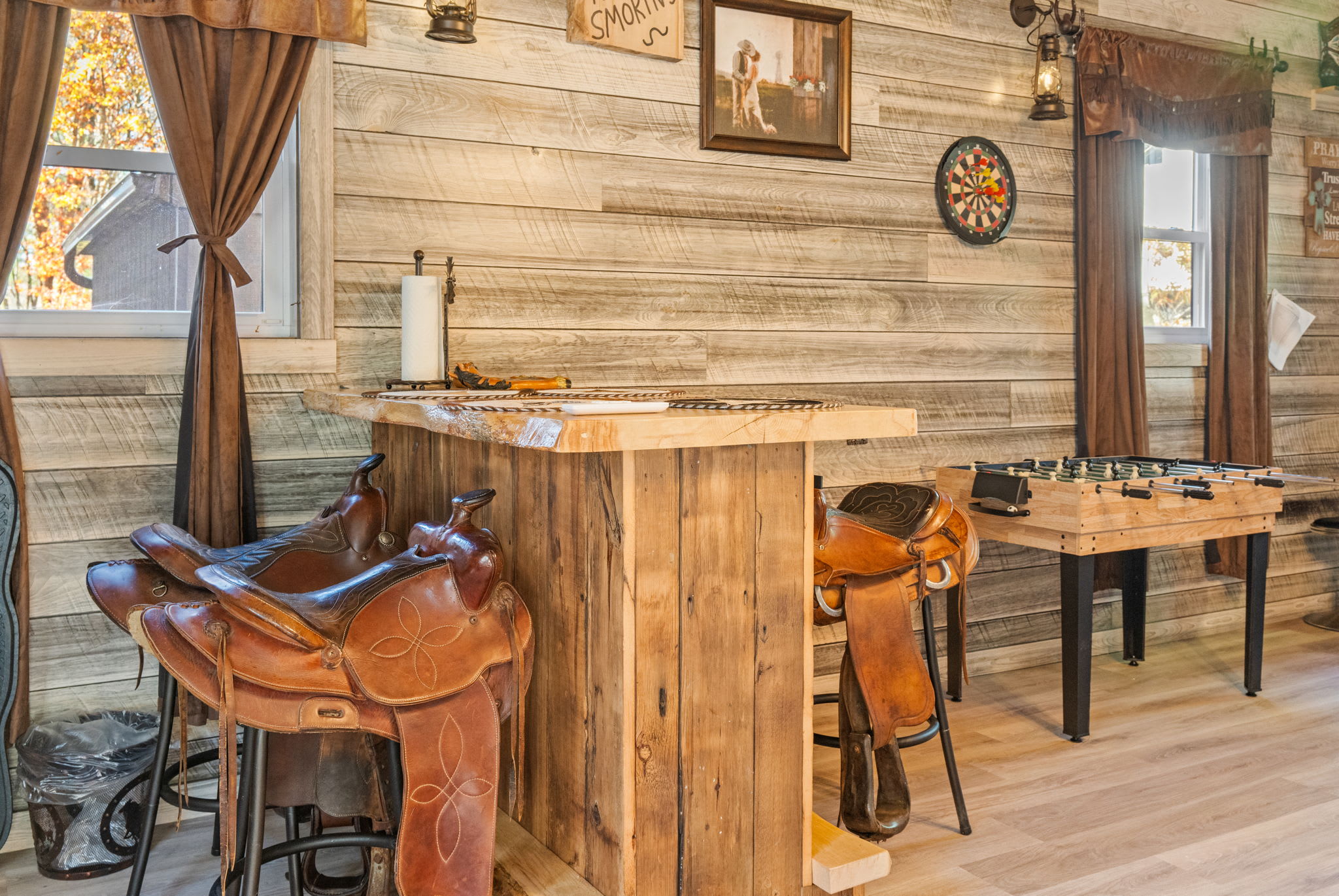 Living room with cathedral ceilings and natural wood beams - spacious and airy mountain home interior