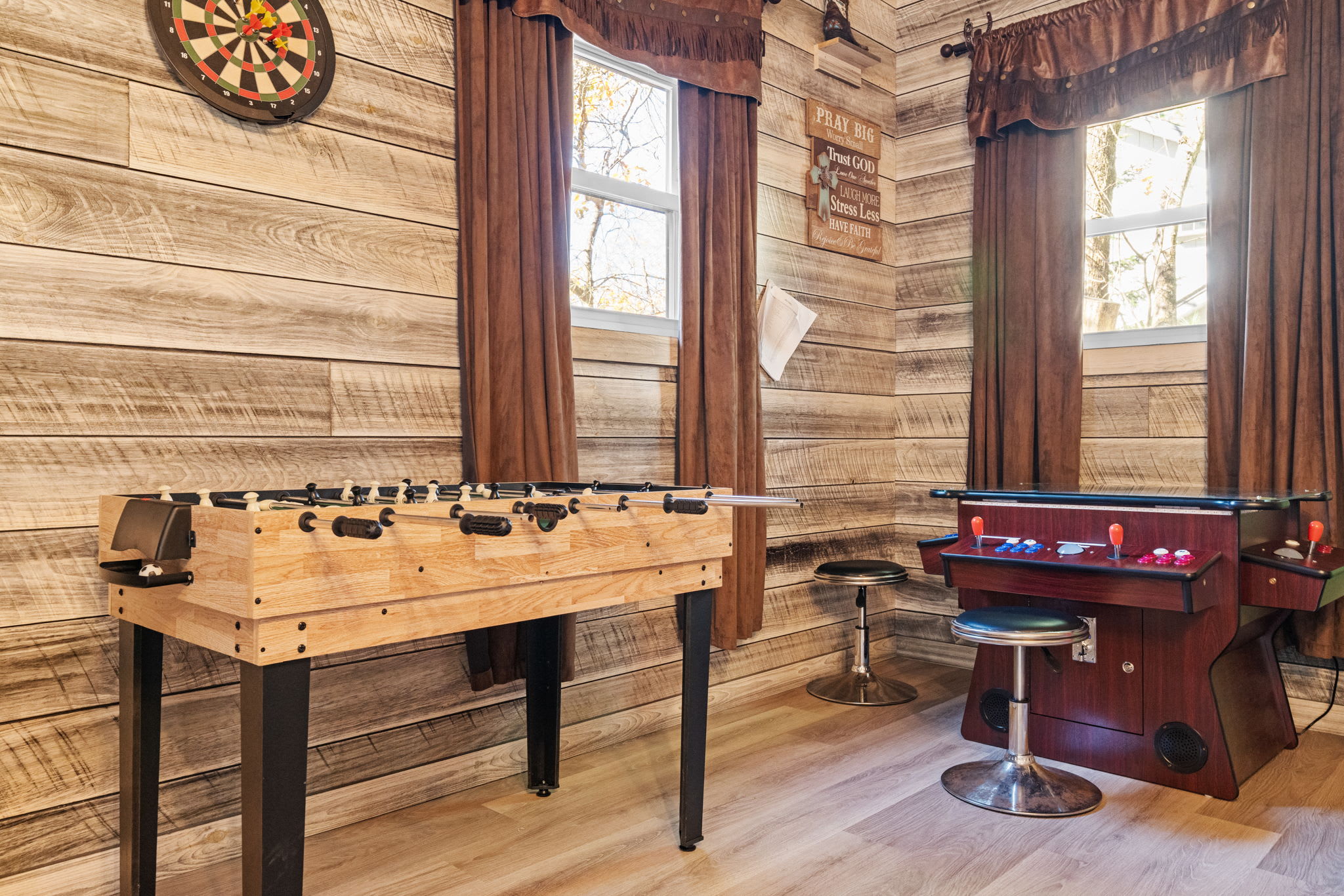 Living room featuring large windows and natural lighting - bright and inviting common space