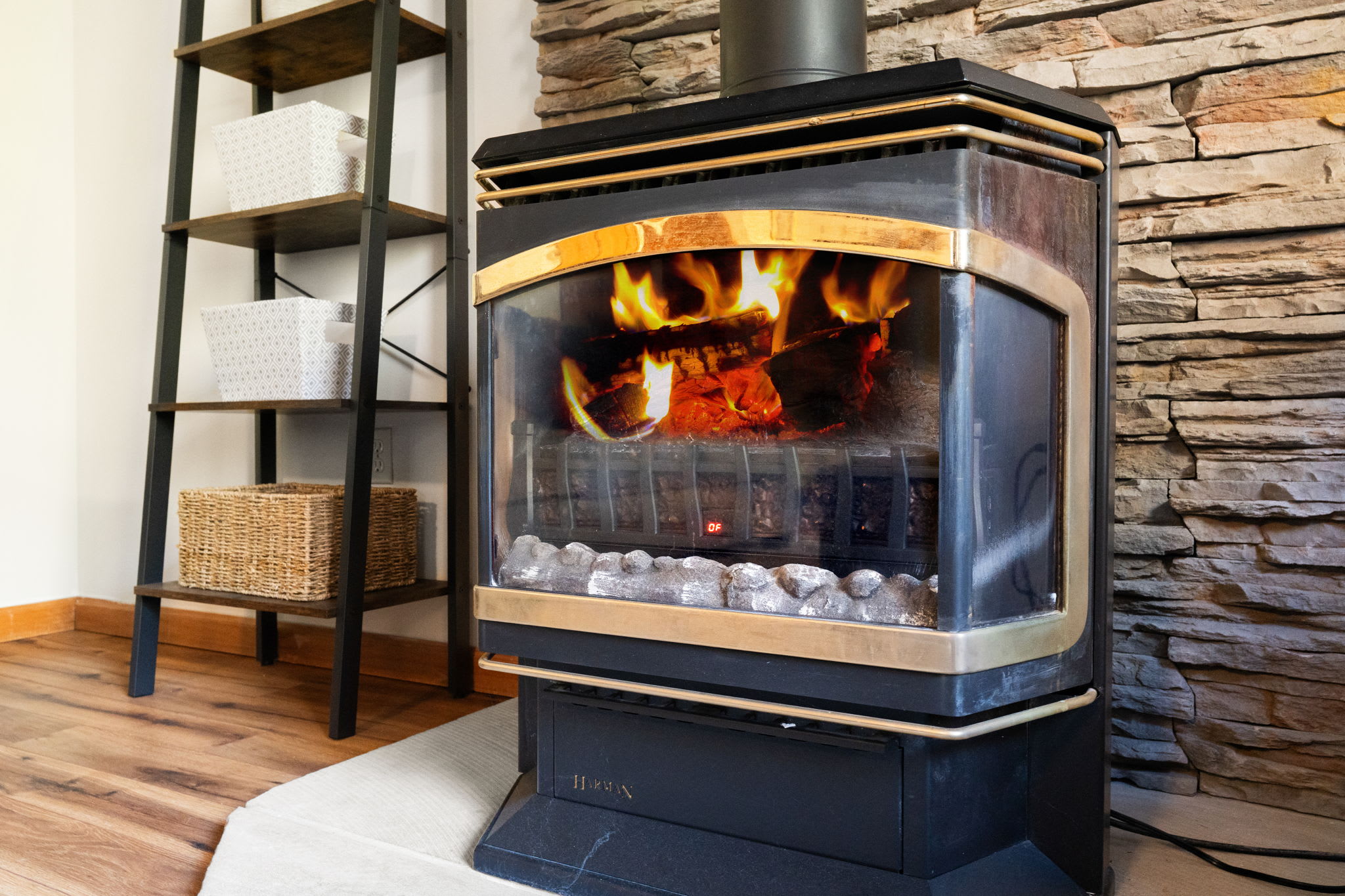 Rustic stone fireplace with cozy ambiance - warm focal point for cold mountain evenings