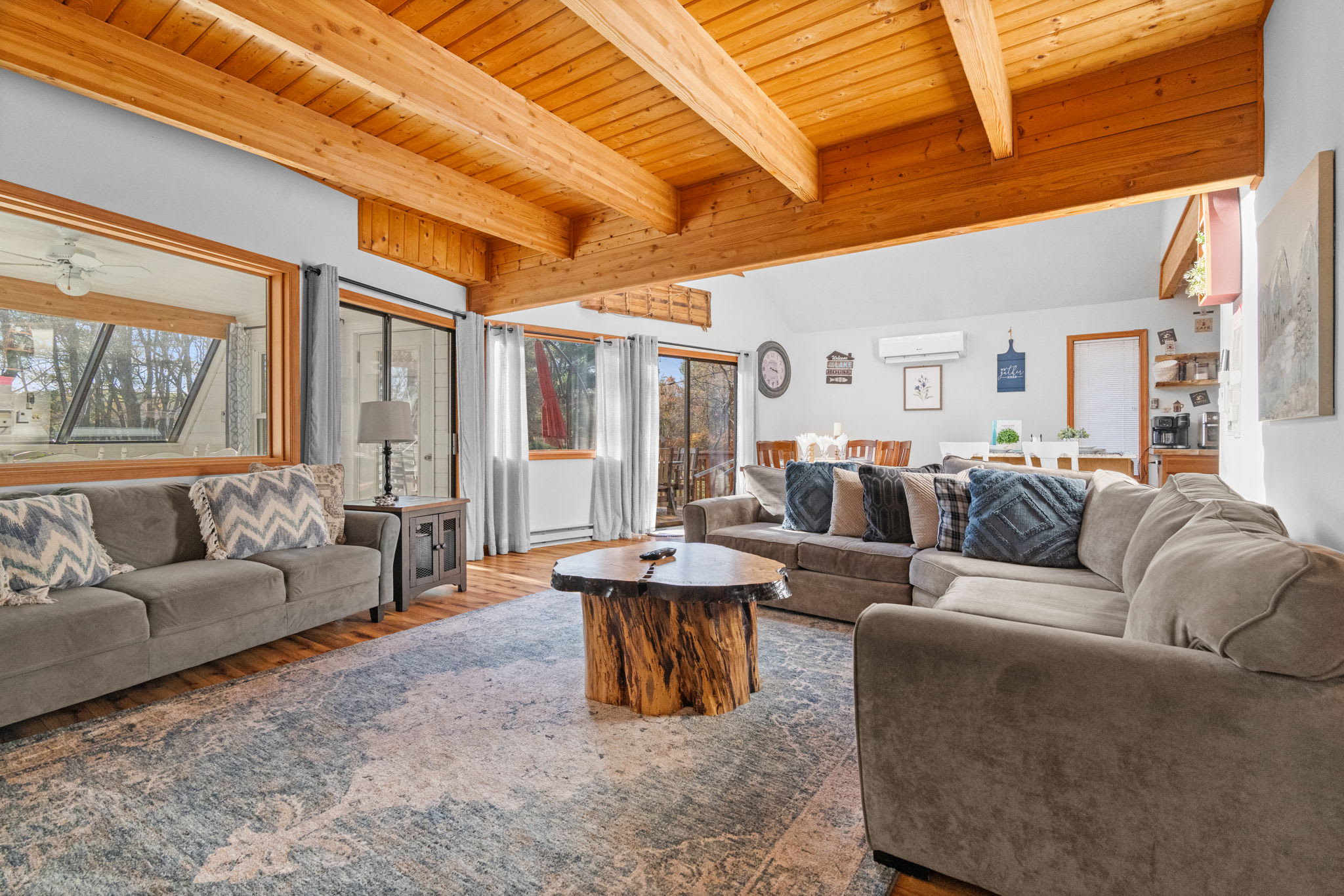 Grand living room with soaring vaulted ceilings and exposed wood beams - impressive A-frame architecture
